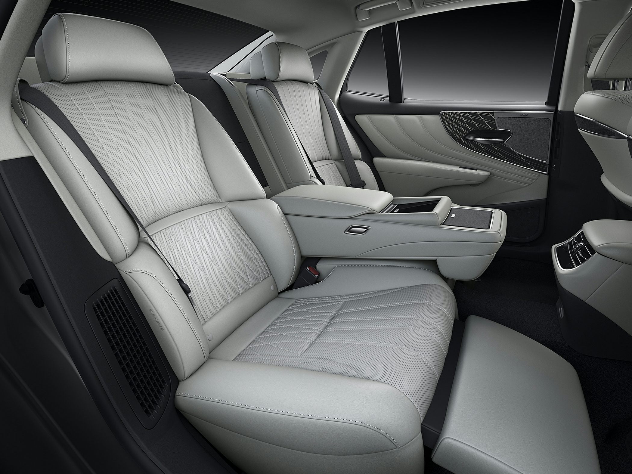 Luxury leather rear passenger seats with reclining footrest and armrest