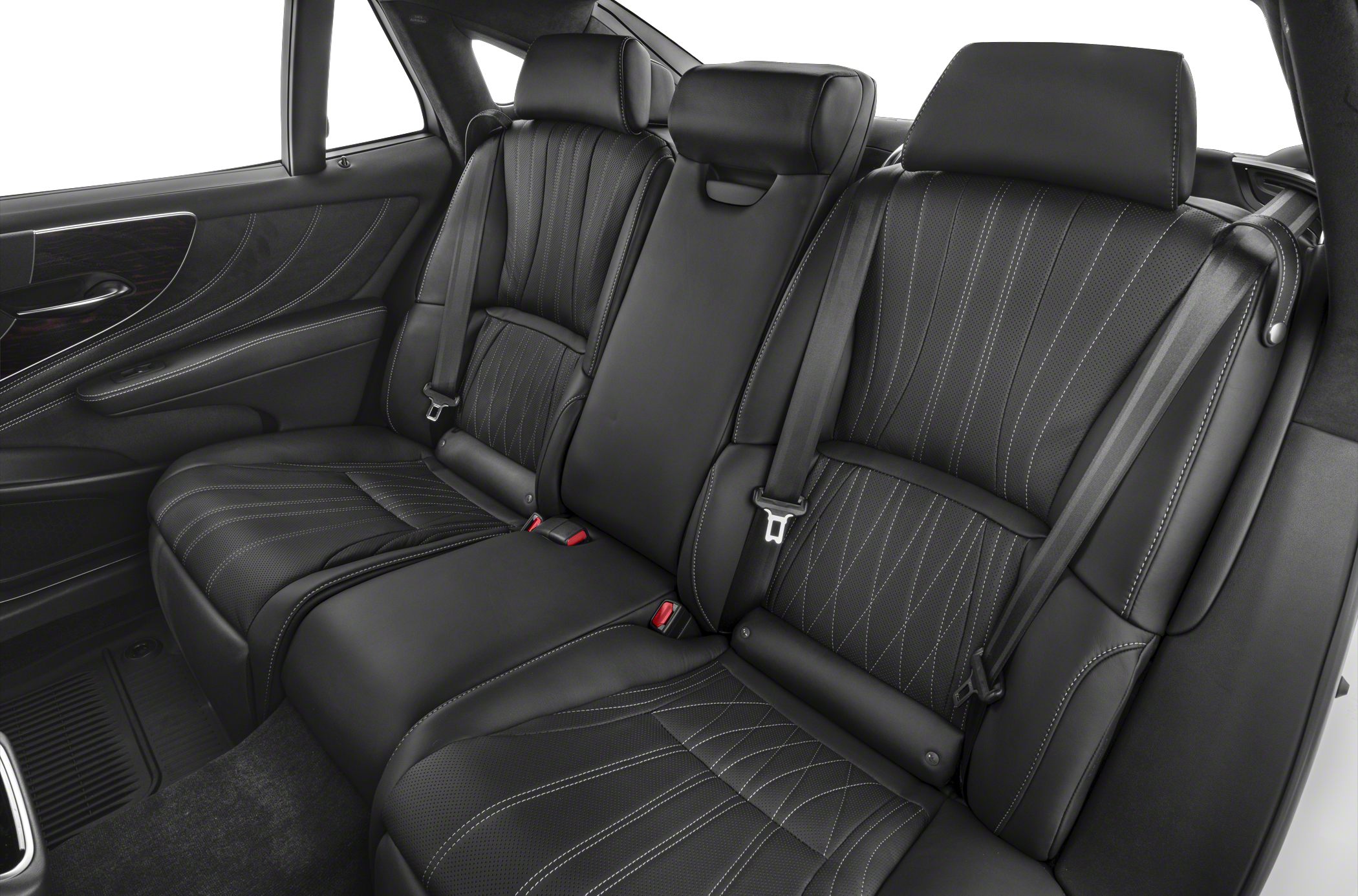 Black leather rear seats with intricate stitching and integrated headrests.