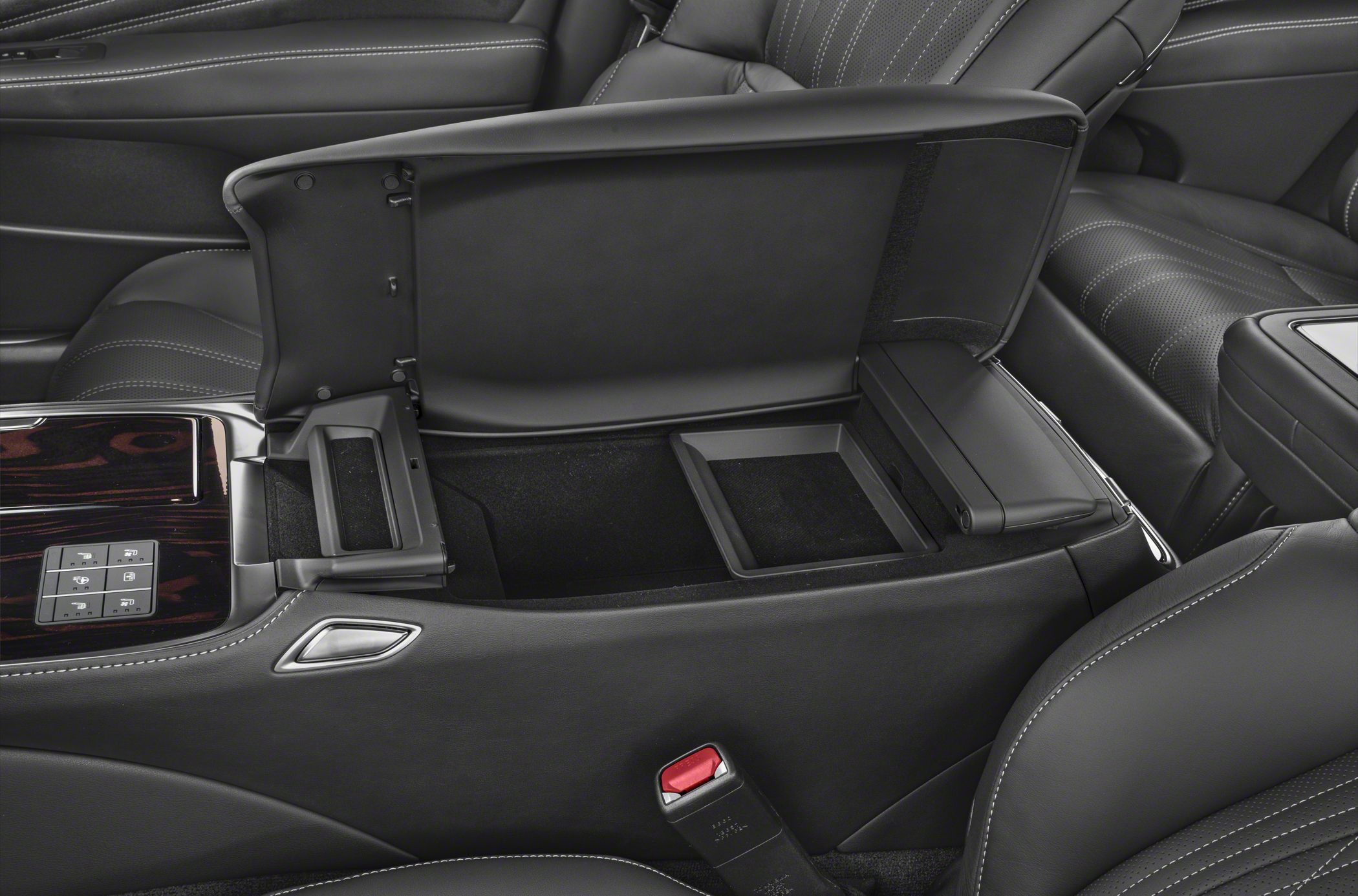 Open center console storage with leather trim and multi-compartment design