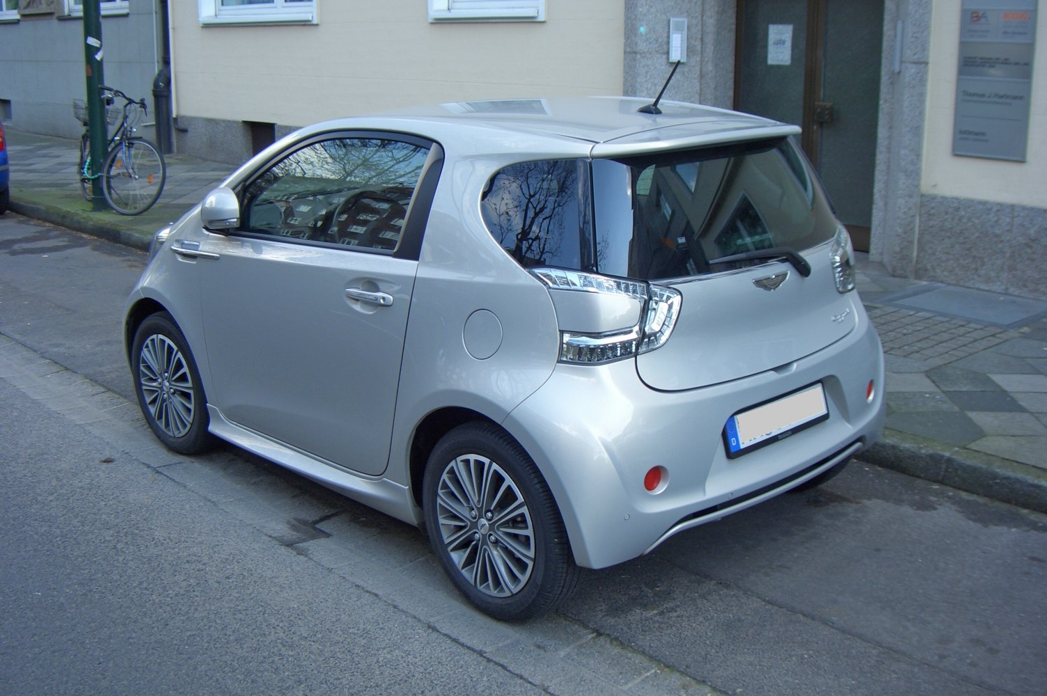 Compact hatchback rear side with LED taillights and alloy wheels