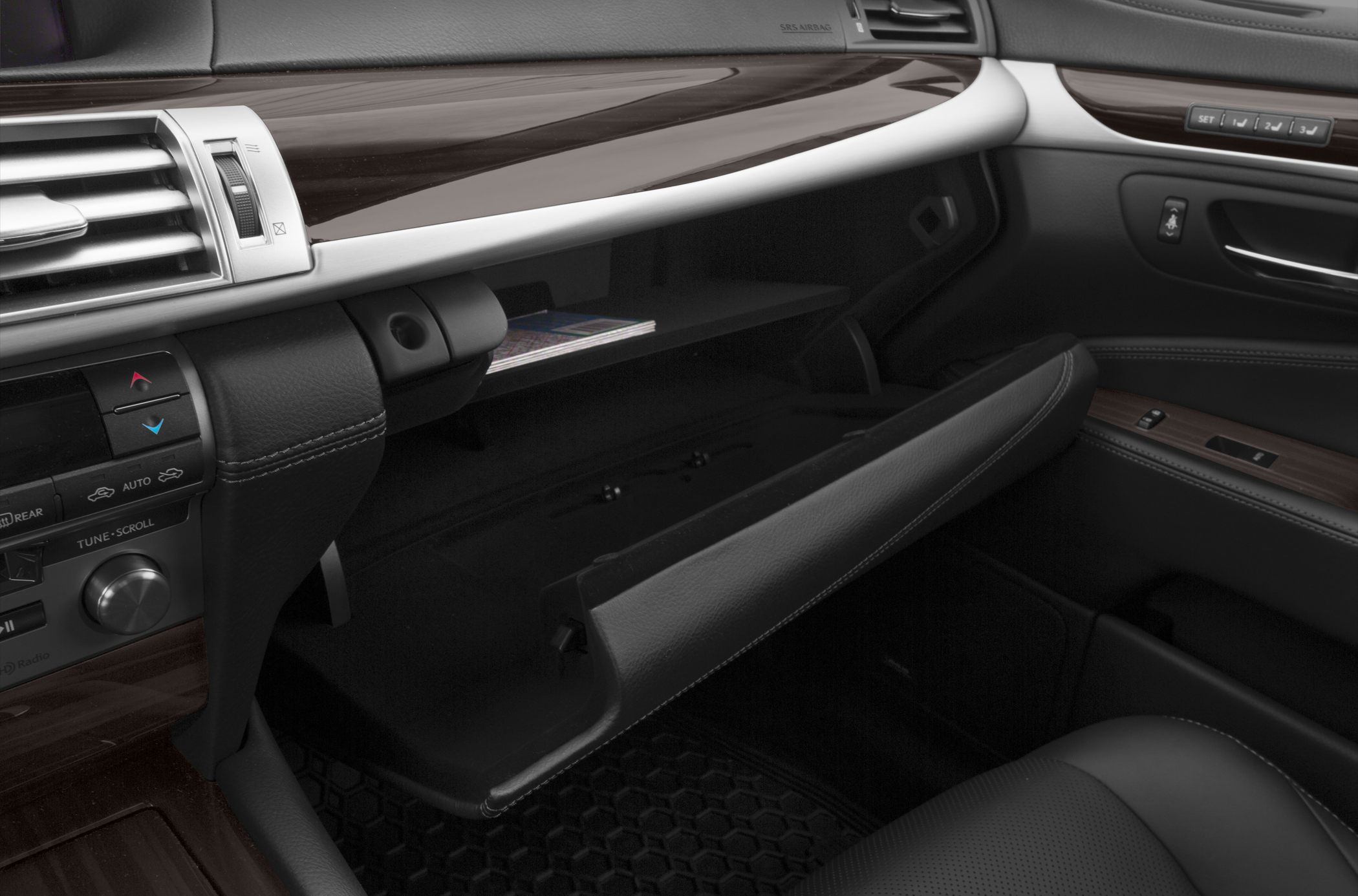 Open glove compartment and luxury dashboard interior detail
