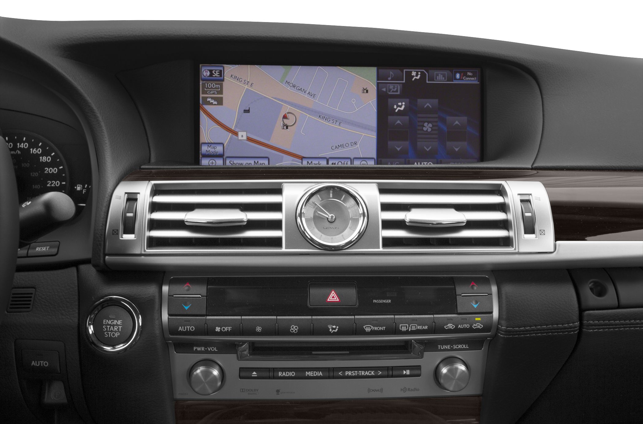 Car dashboard with GPS navigation, analog clock, and climate controls