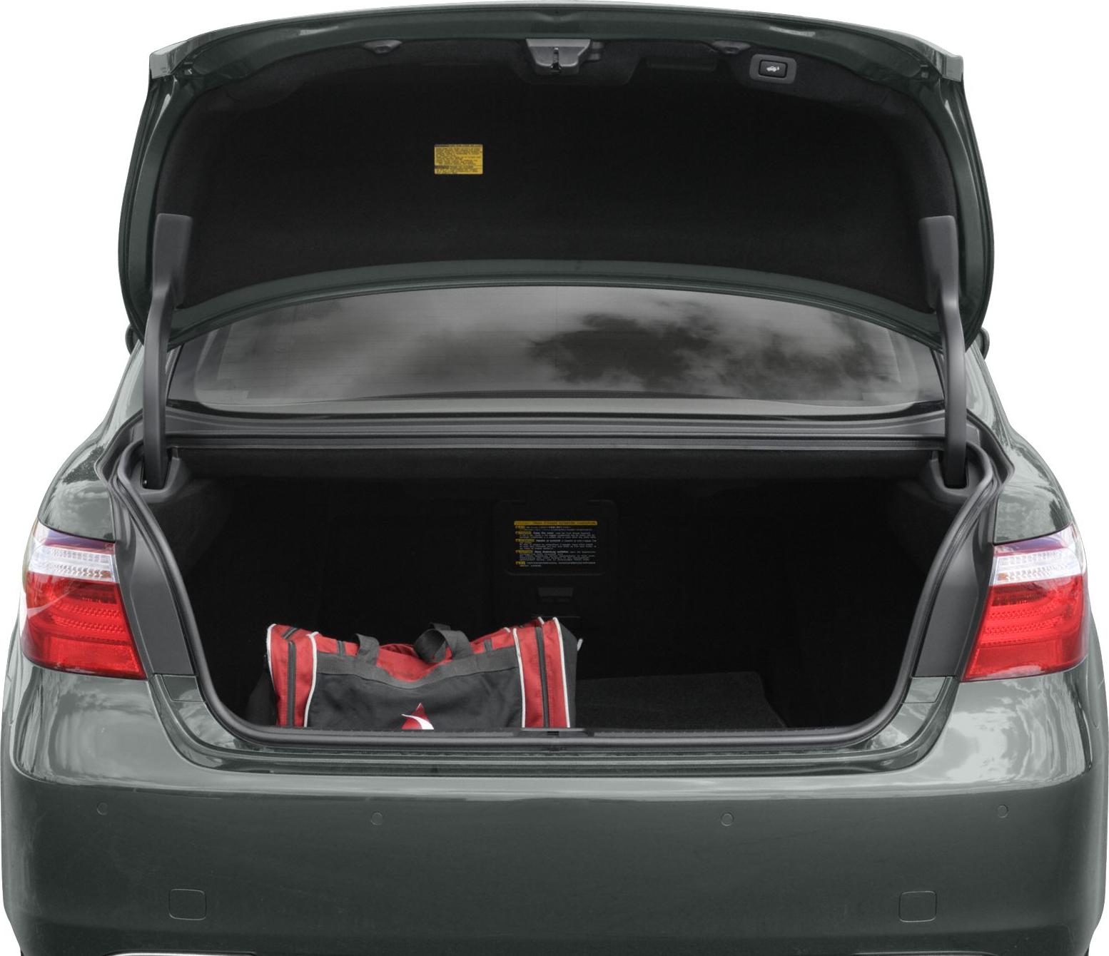 Open spacious sedan trunk with visible rear lights and cargo space