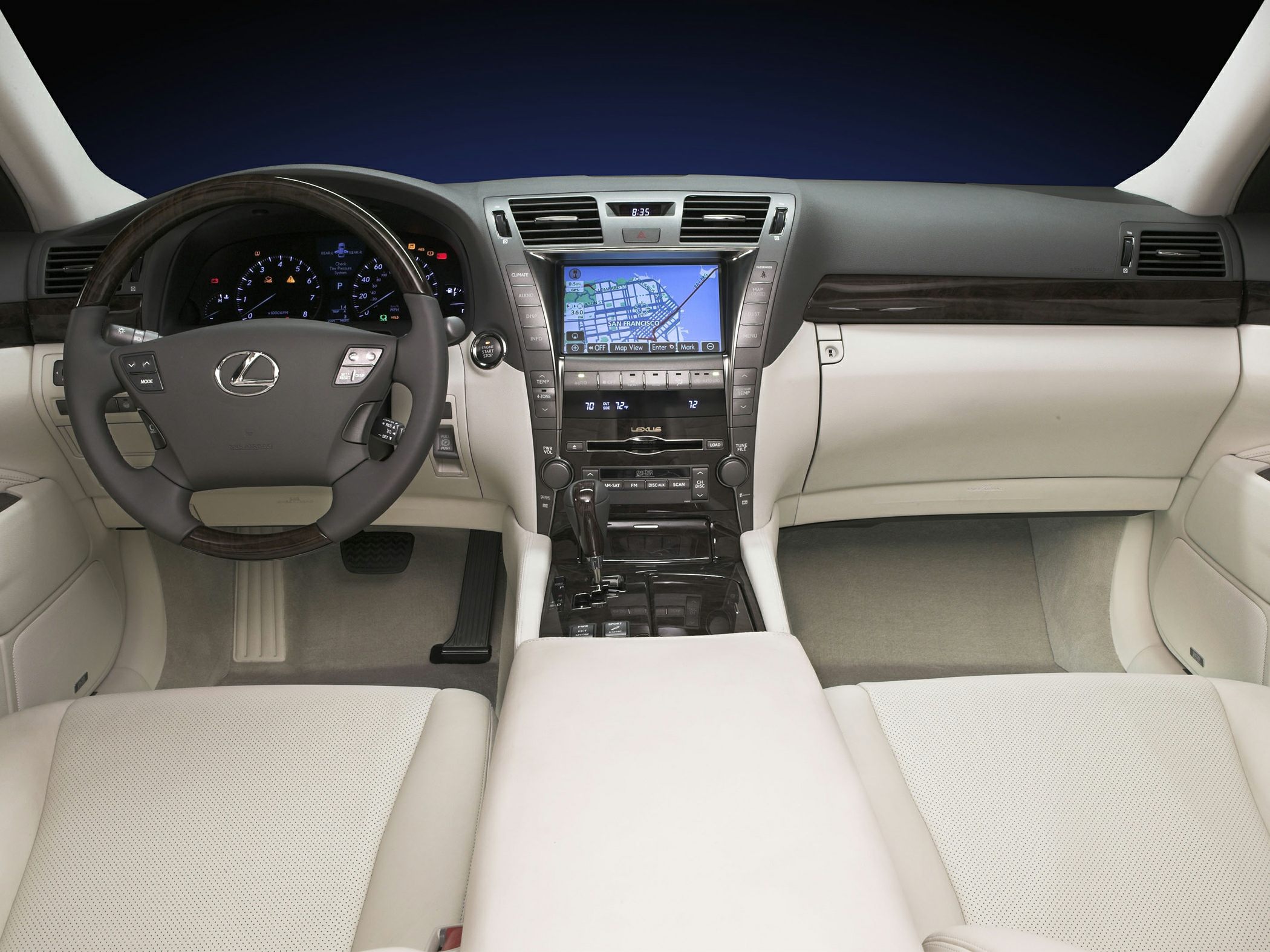 Luxury car interior dashboard with navigation screen and wood trim