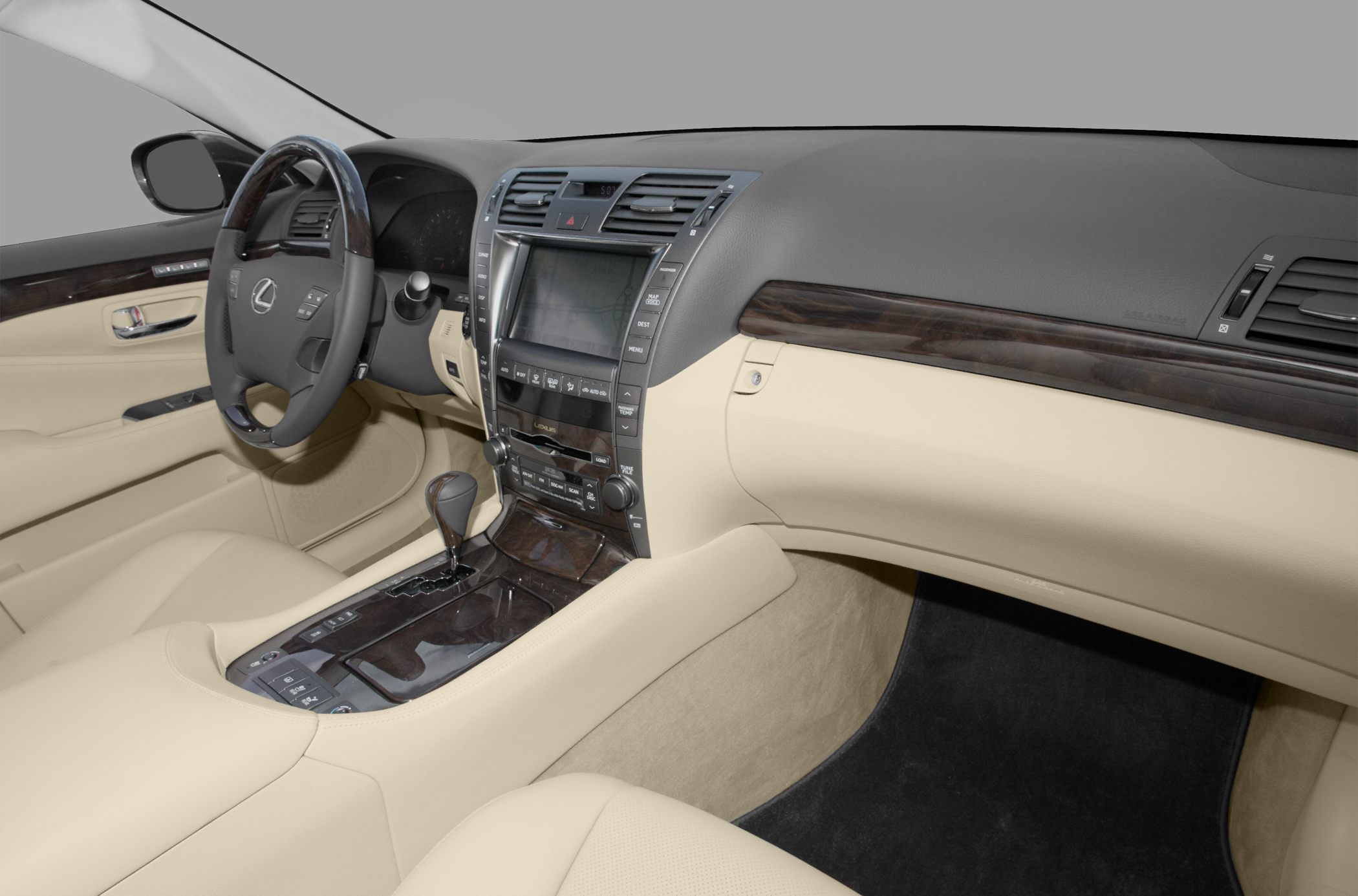 Beige leather interior with wood-trimmed dashboard and advanced infotainment system