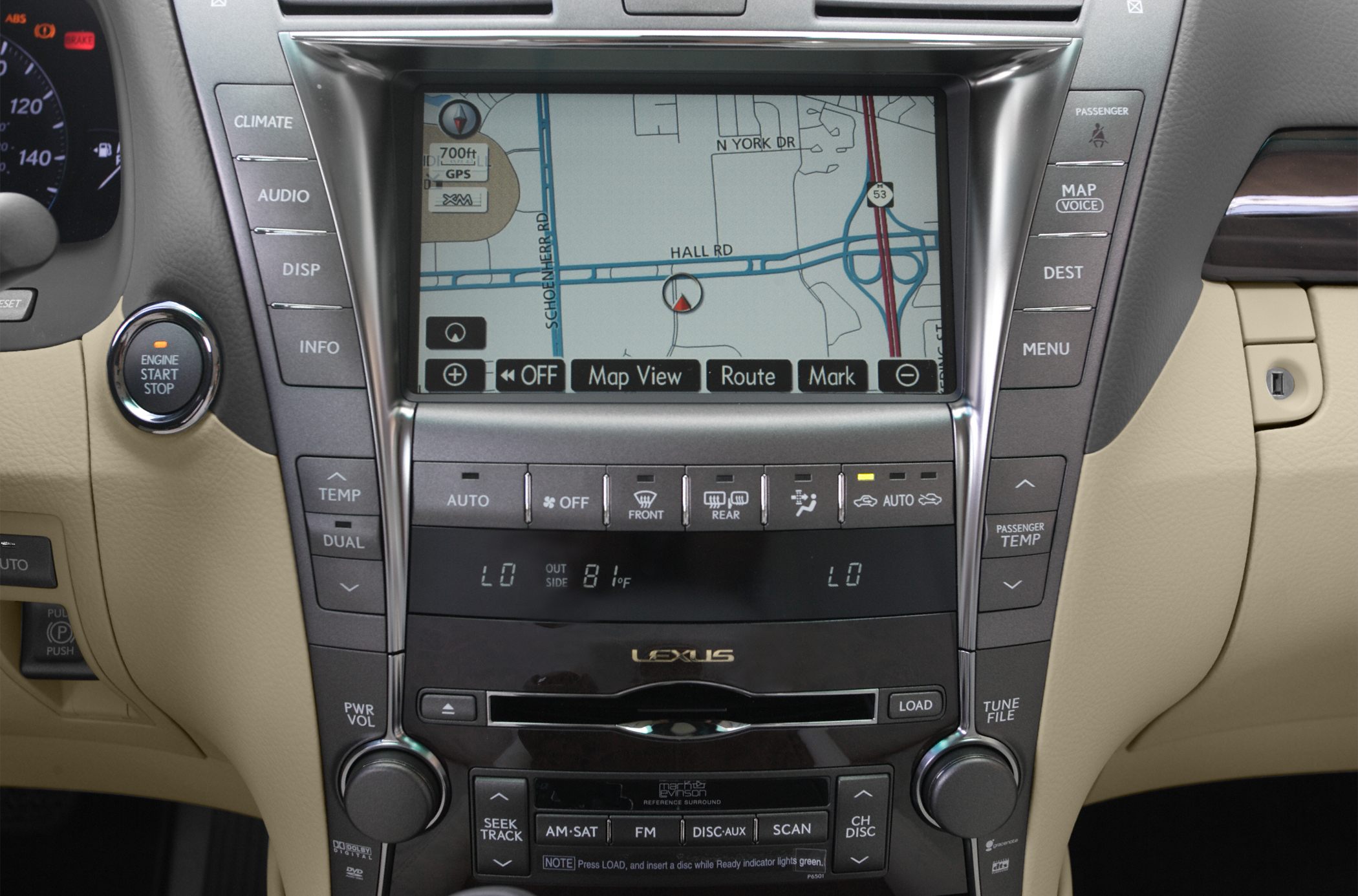 Car dashboard with navigation screen and climate control buttons