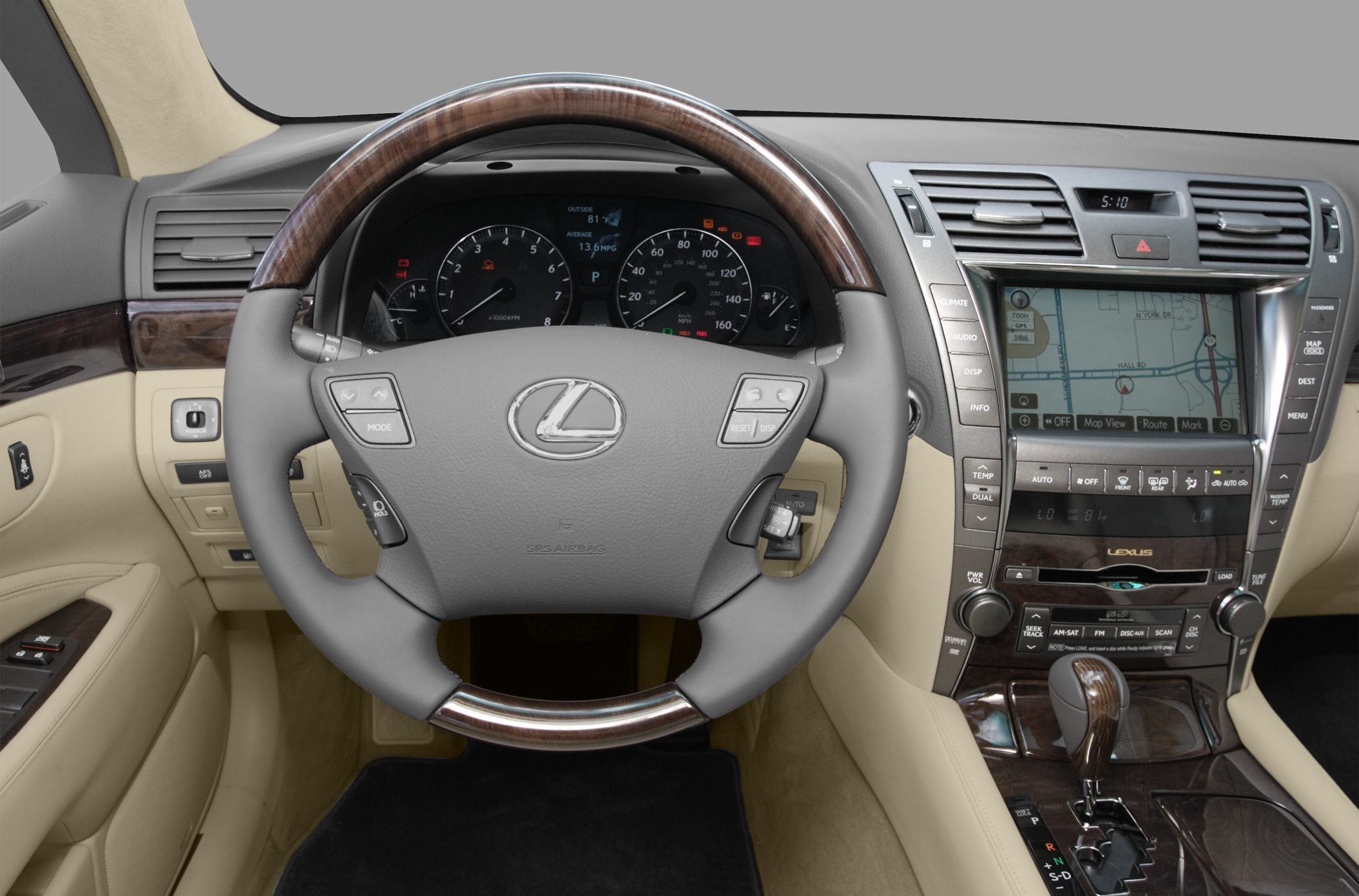 Wood trim steering wheel and dashboard with navigation screen and controls