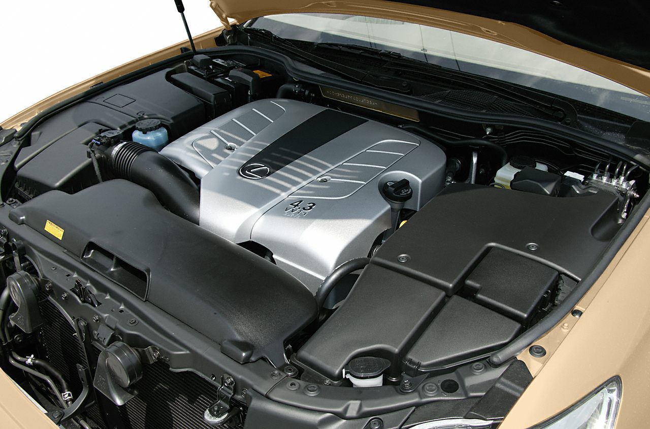 Detailed engine bay featuring 4.3 V8 engine with cover and intake components.
