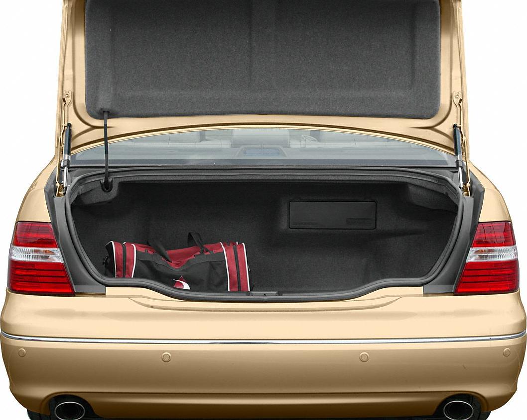Open rear trunk with spacious cargo area and red-black duffel bag
