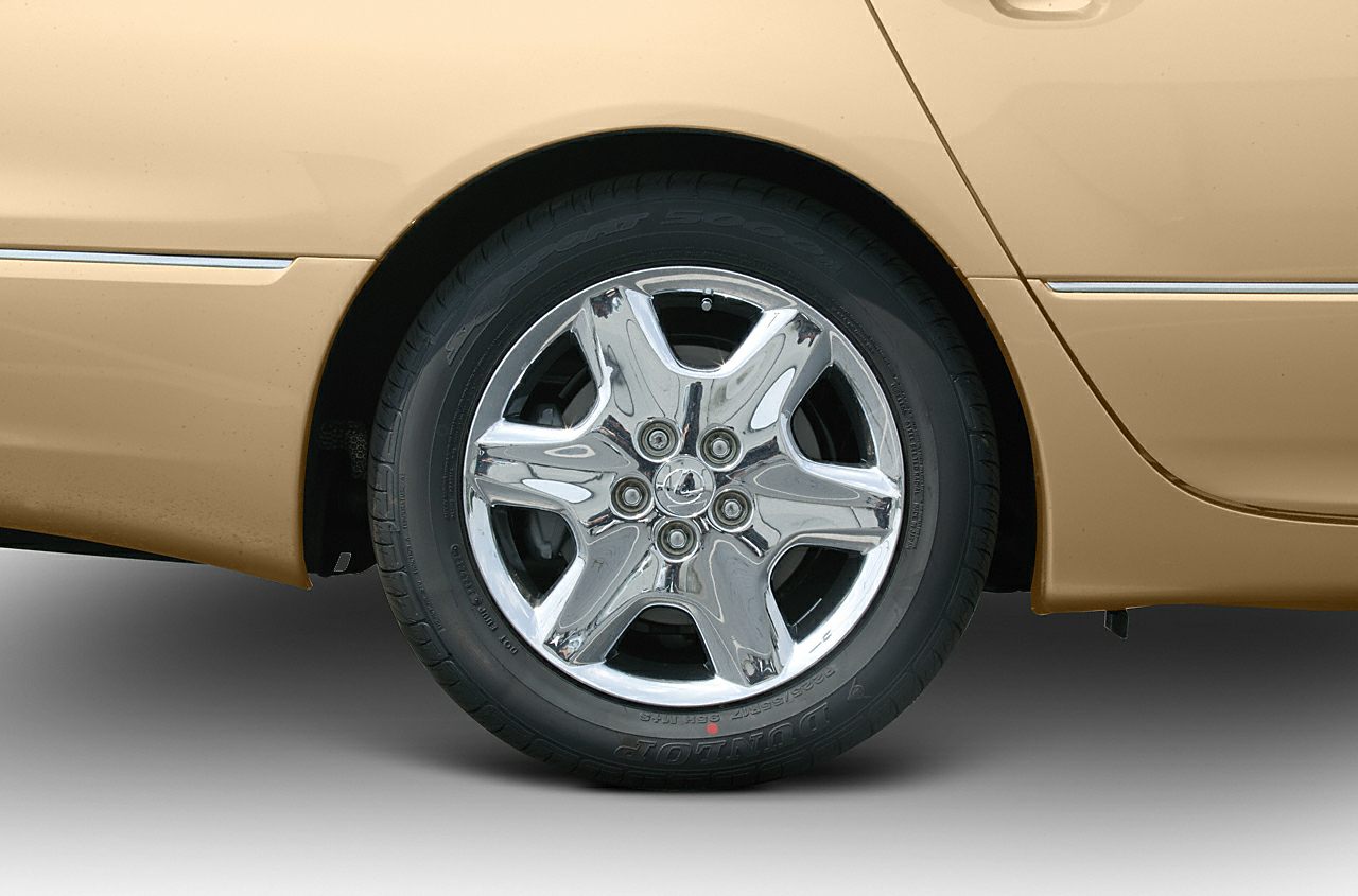 Chrome multi-spoke wheel and tire close-up