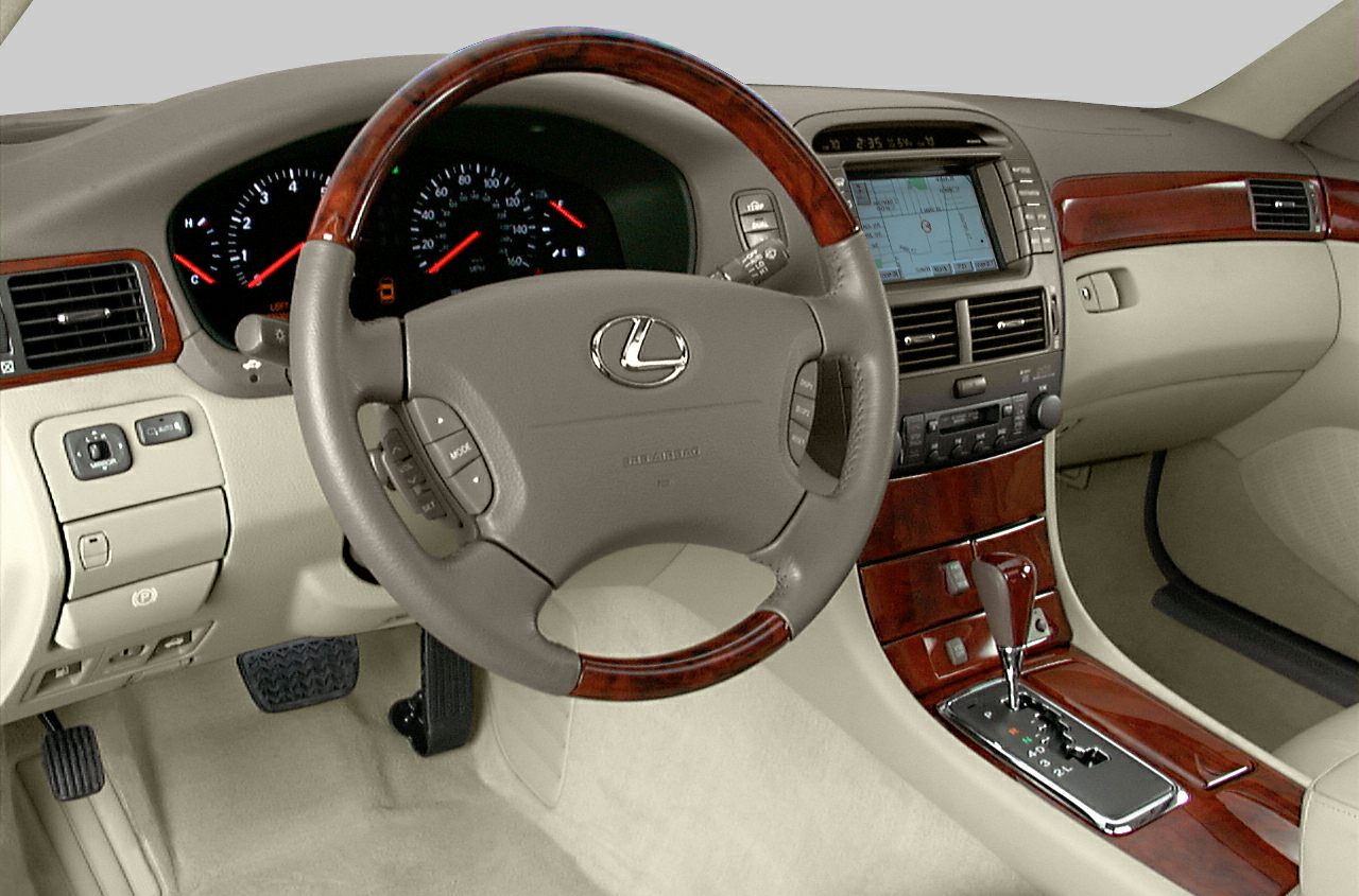 Wood-trimmed steering wheel and dashboard with navigation display