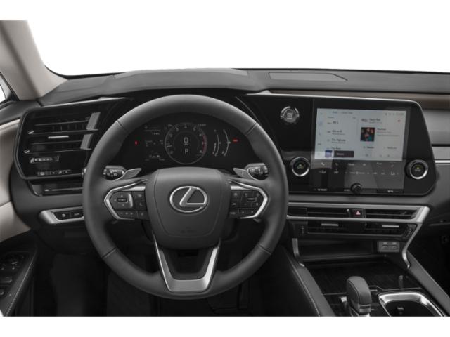 Modern steering wheel and touchscreen infotainment in luxury SUV interior