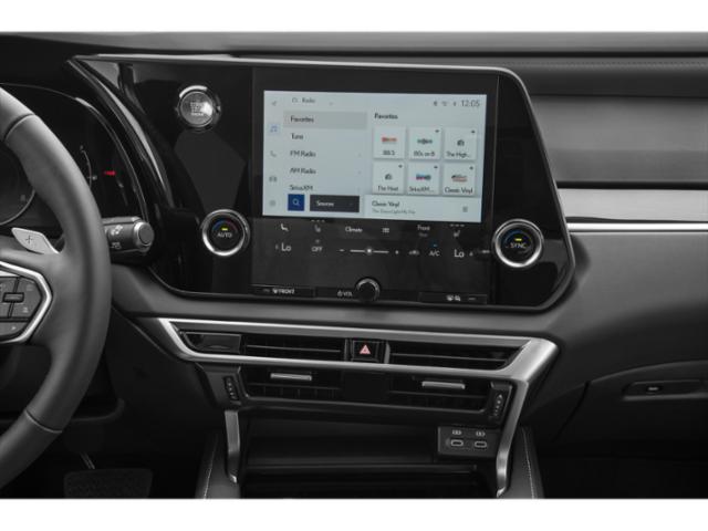 Touchscreen infotainment and dual-zone climate controls, sleek modern dashboard