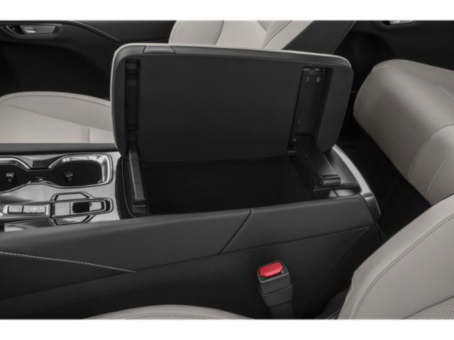Spacious center console storage with premium armrest in a luxury SUV interior.