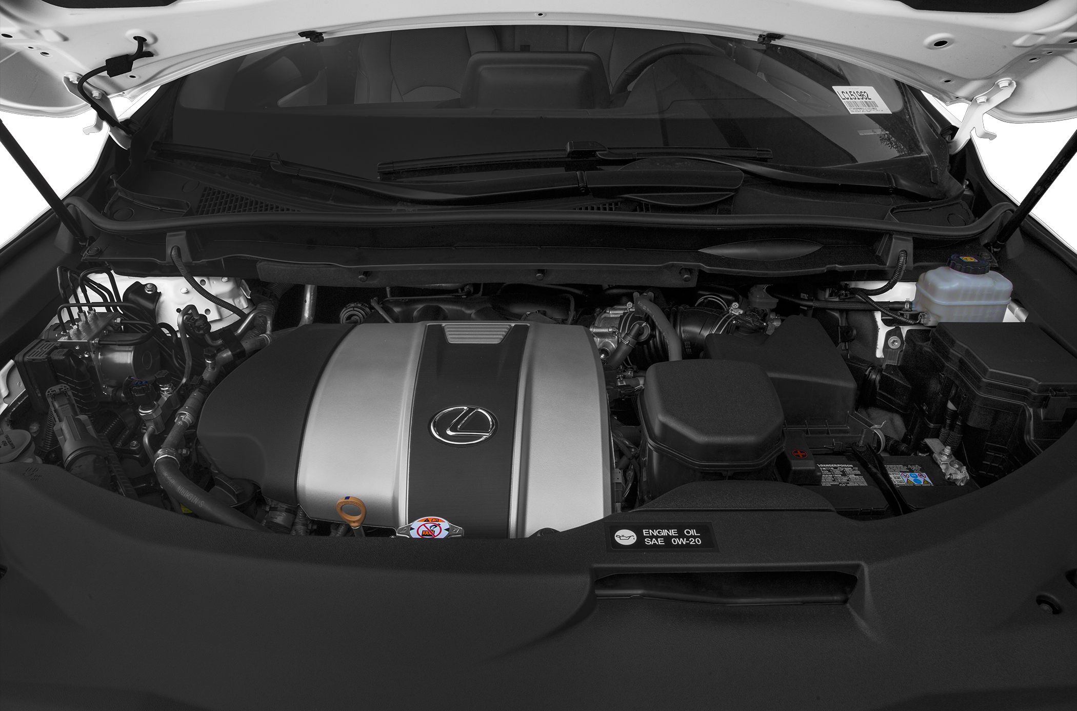 Engine bay with Lexus emblem and engine cover in a luxury SUV