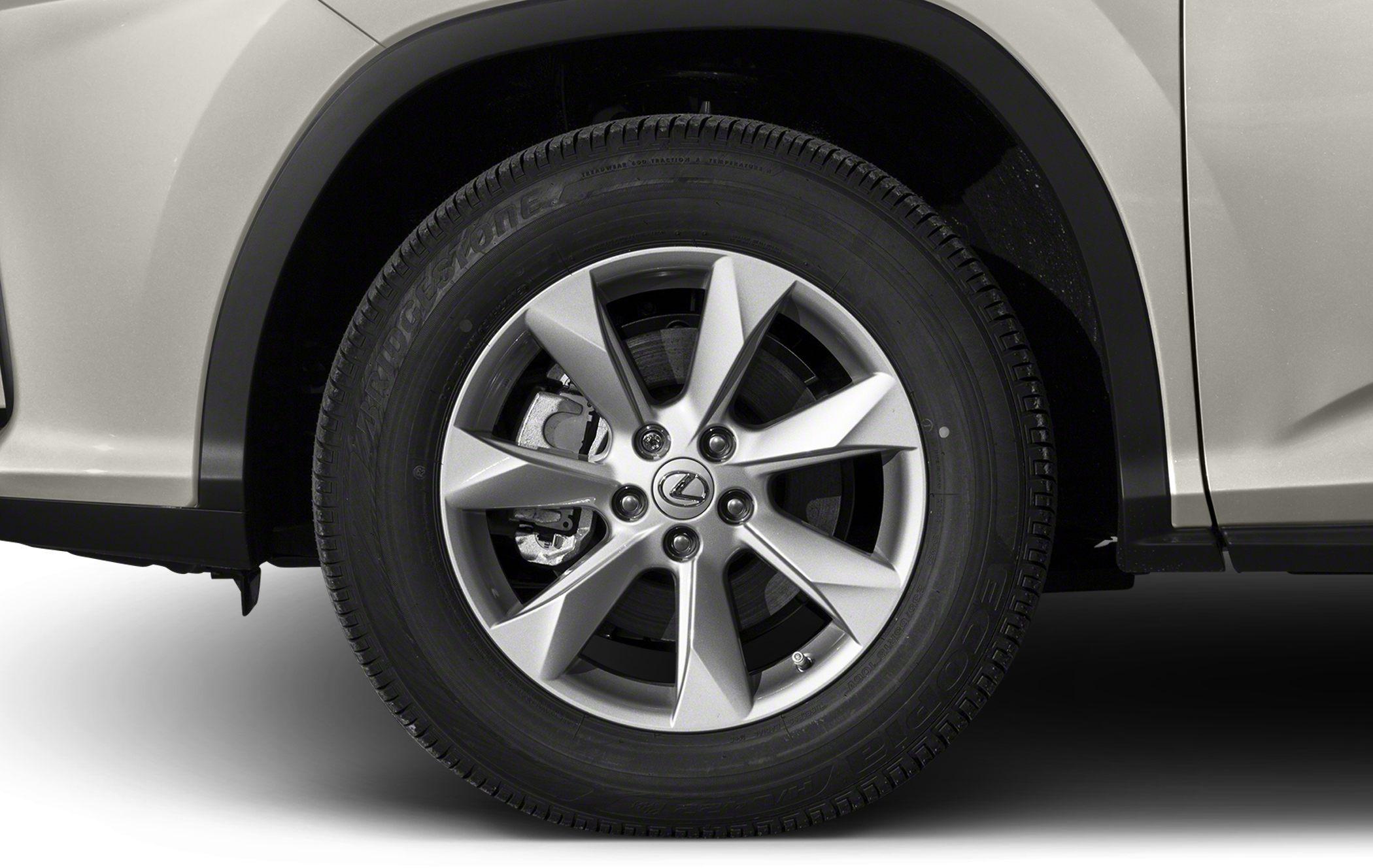 Close-up of alloy wheel and tire with visible brake caliper and wheel arch.