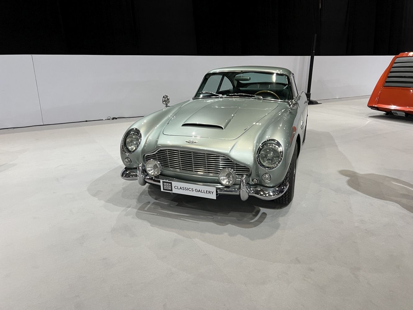 Classic vintage sports car front grille and round headlights.