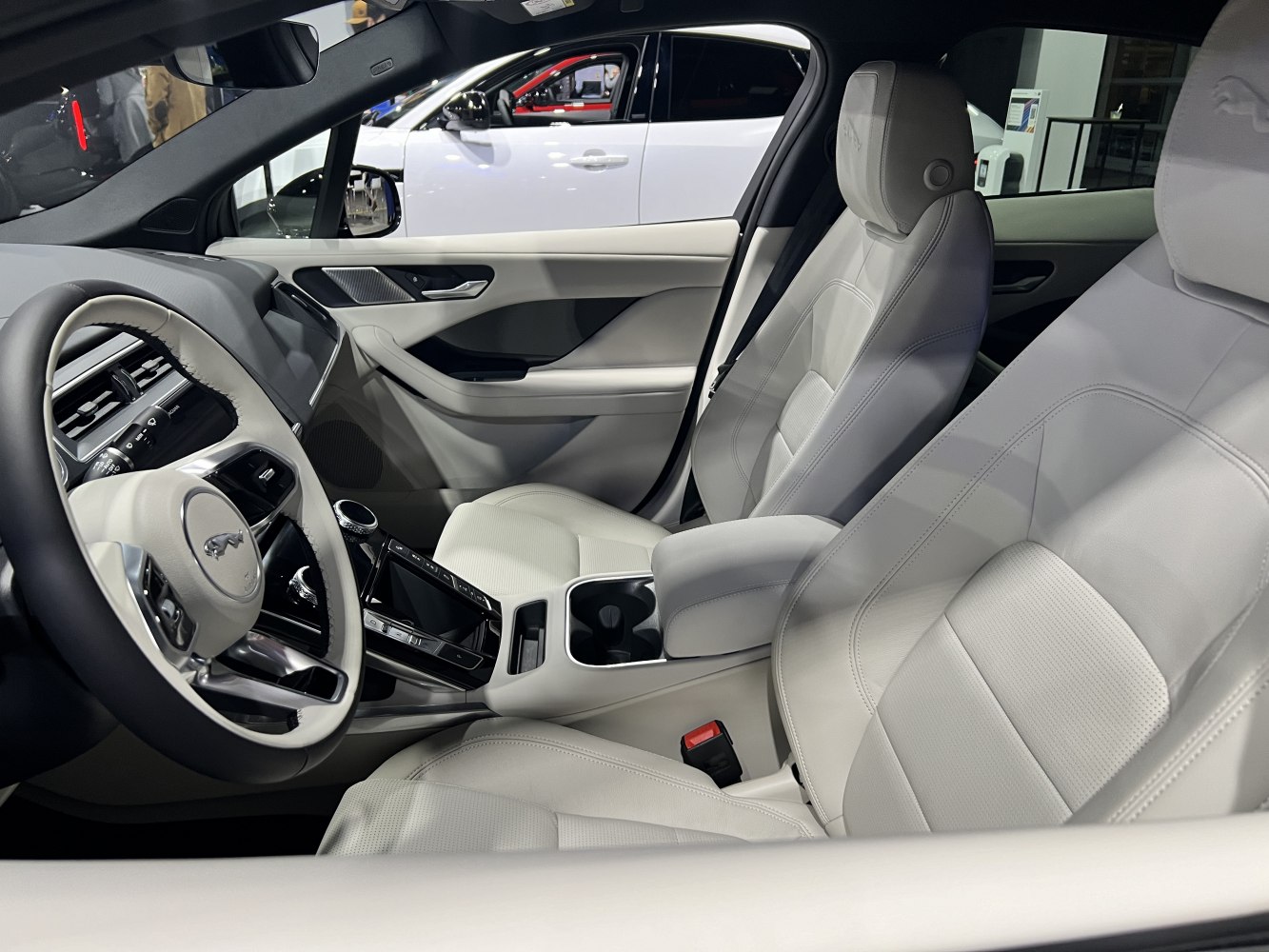 Leather seats and advanced steering wheel design in modern electric SUV interior