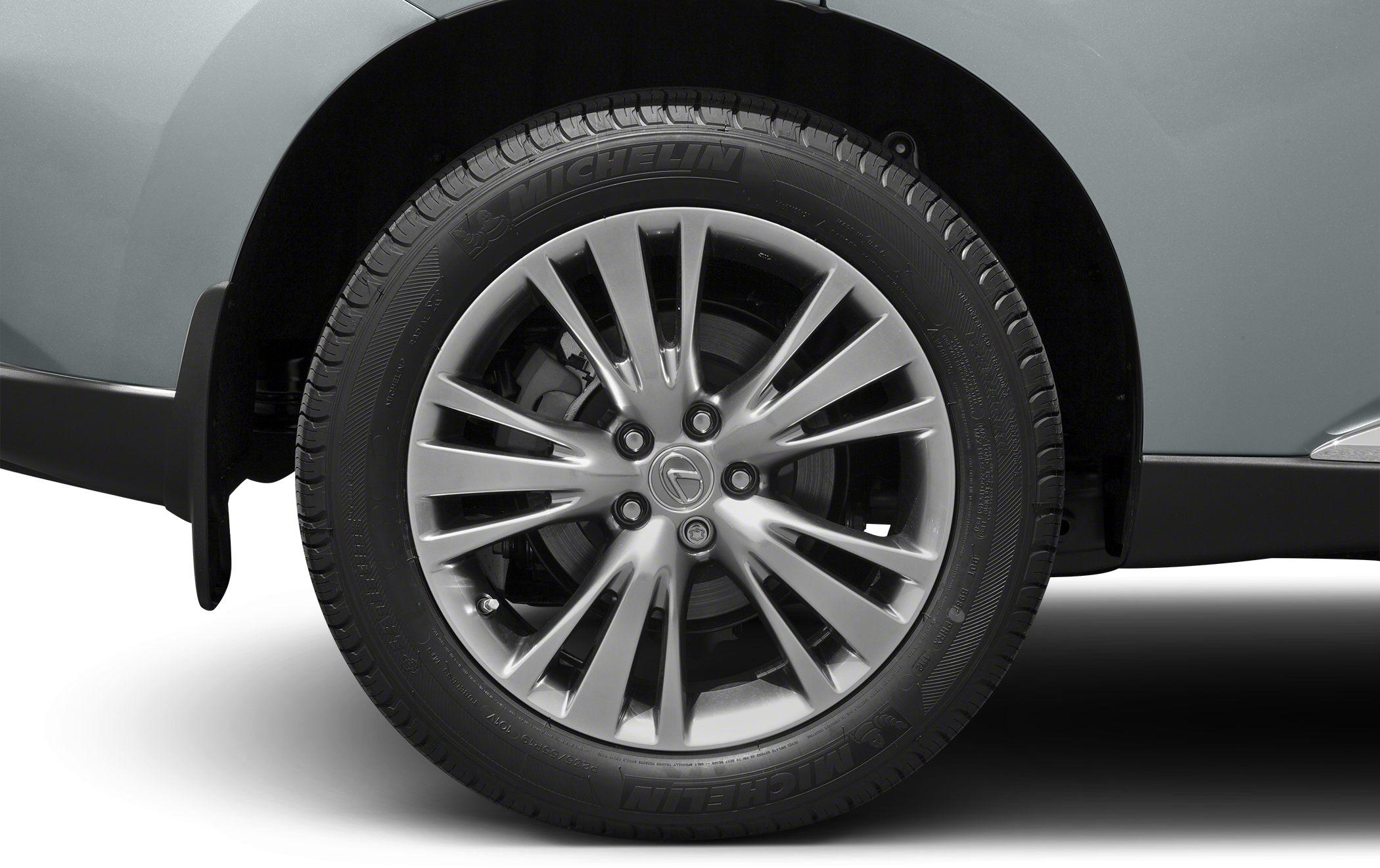Close-up of alloy wheel with Michelin tire and multi-spoke design.