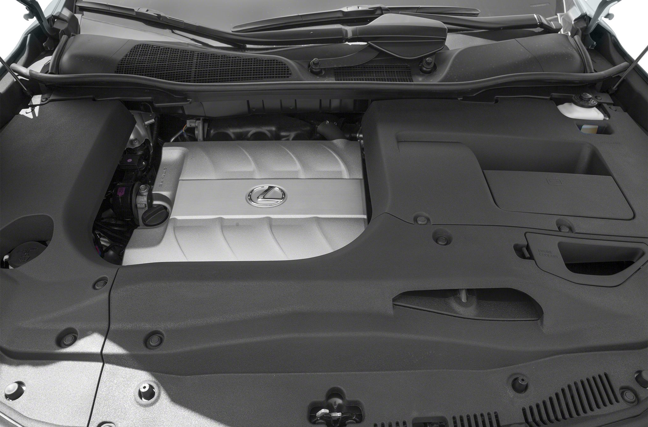 Engine bay with Lexus-branded silver engine cover and surrounding plastic housing