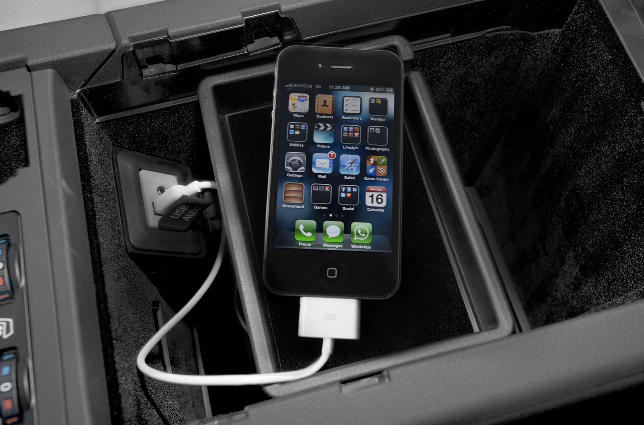 USB AUX port with smartphone connected inside center console compartment