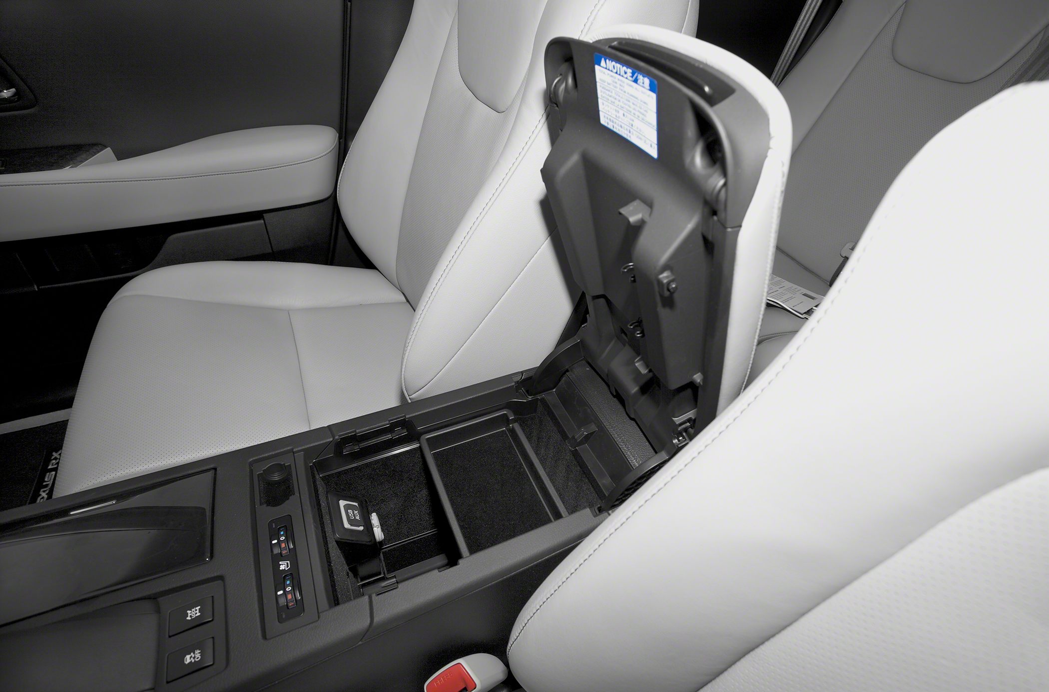 Center console with open storage compartment and seat heater controls
