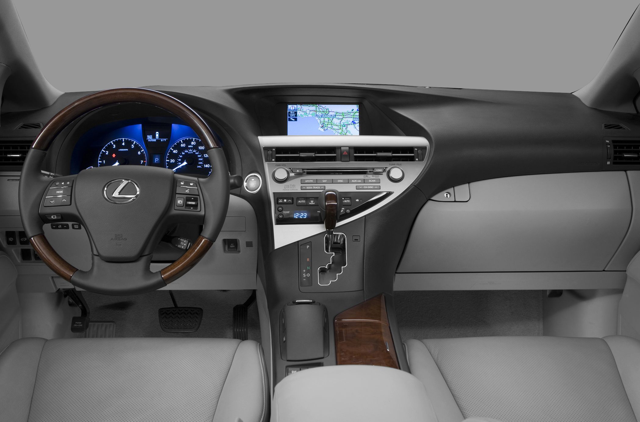 Dashboard with navigation display, wooden trim, and leather-wrapped steering wheel