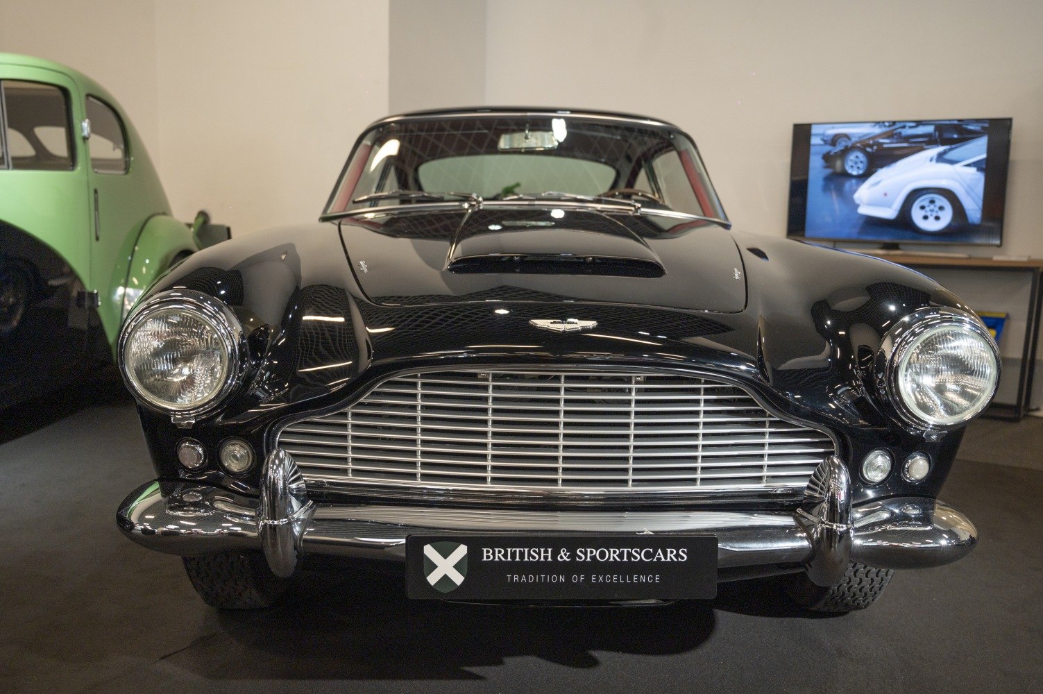 Front view of vintage sports car with iconic grille and round headlights