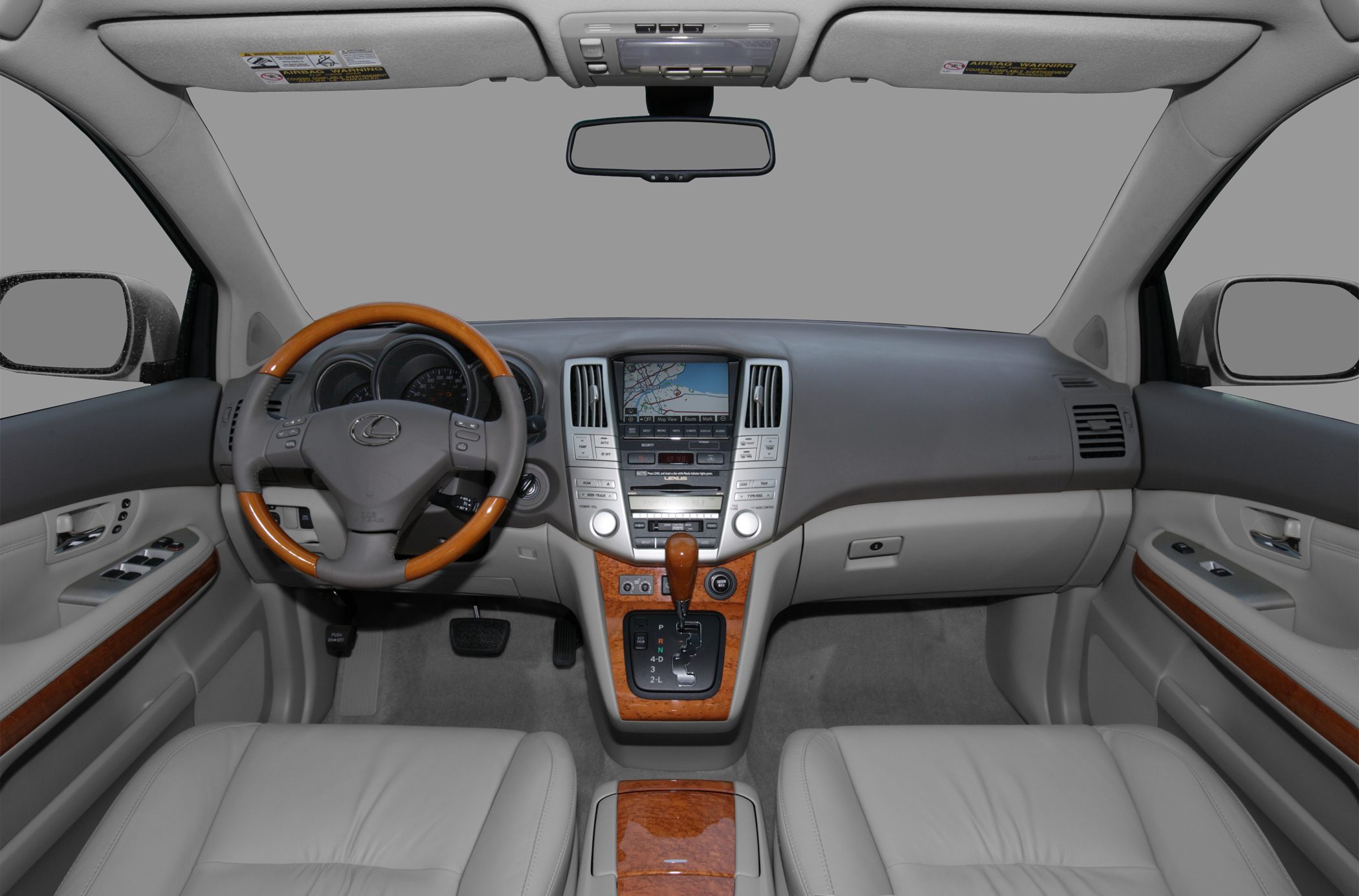 Dashboard and steering wheel with wood trim and navigation display