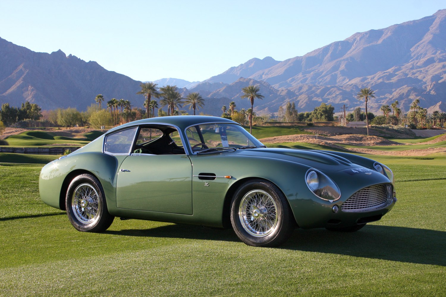 Vintage elegant sports coupe with wire wheels and curved roofline