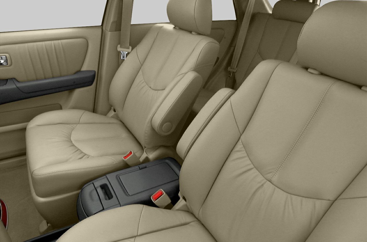 Beige leather front seats with armrests and center console