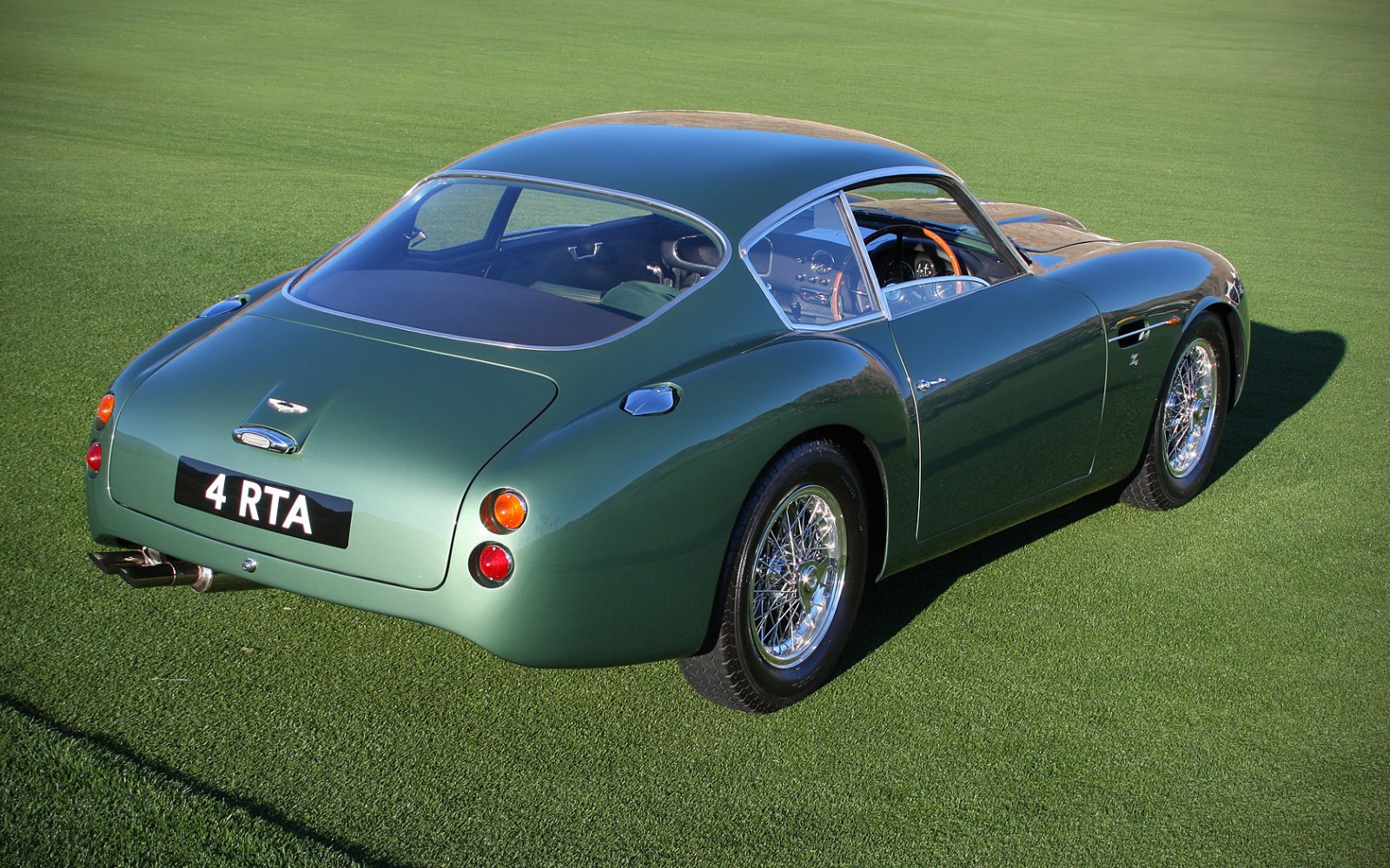 Rear view of vintage sports coupe with wire wheels