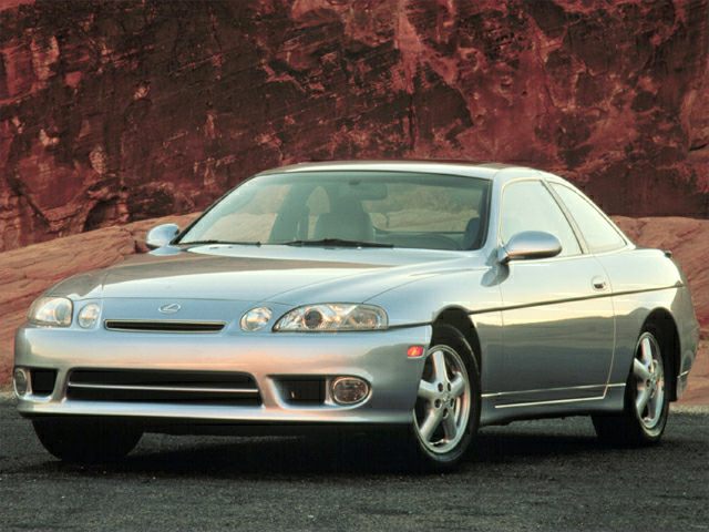 Silver coupe showing front and side with distinctive headlights