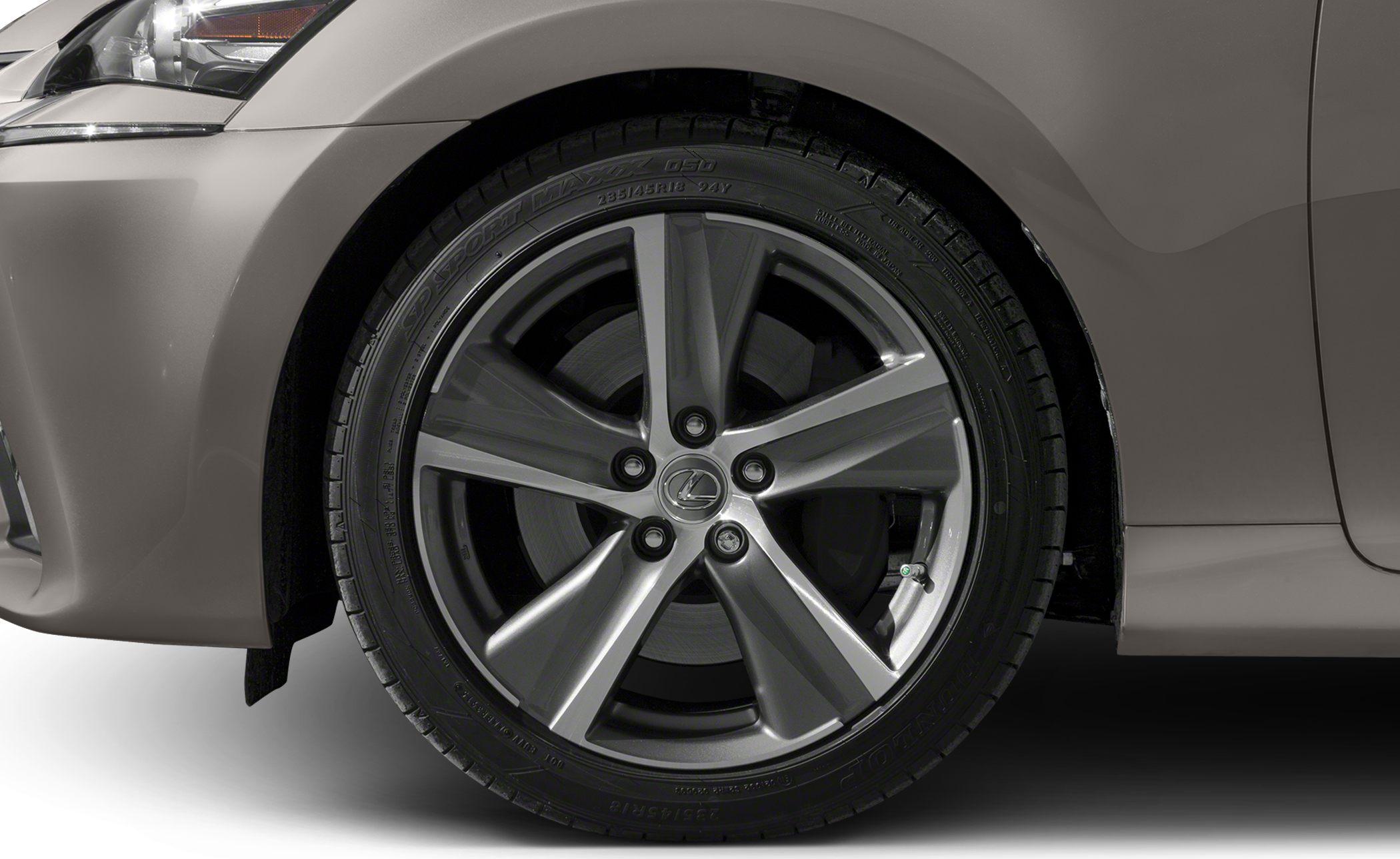 Close-up of a 5-spoke alloy rim and Dunlop tire.