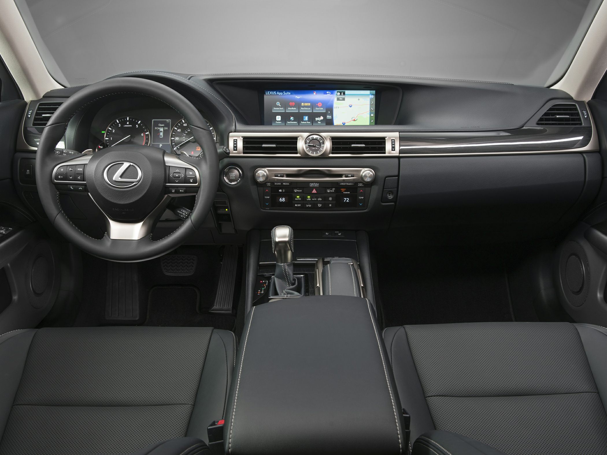 Luxury car interior with dashboard, steering wheel, and infotainment display.