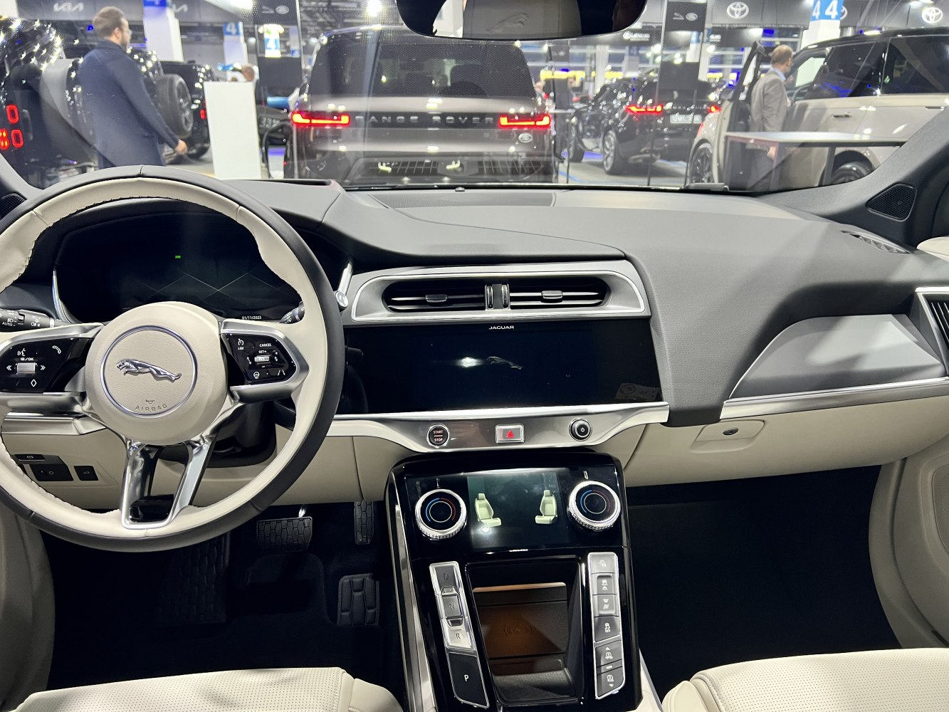 Modern digital dashboard and dual touchscreen center console with multifunction steering wheel