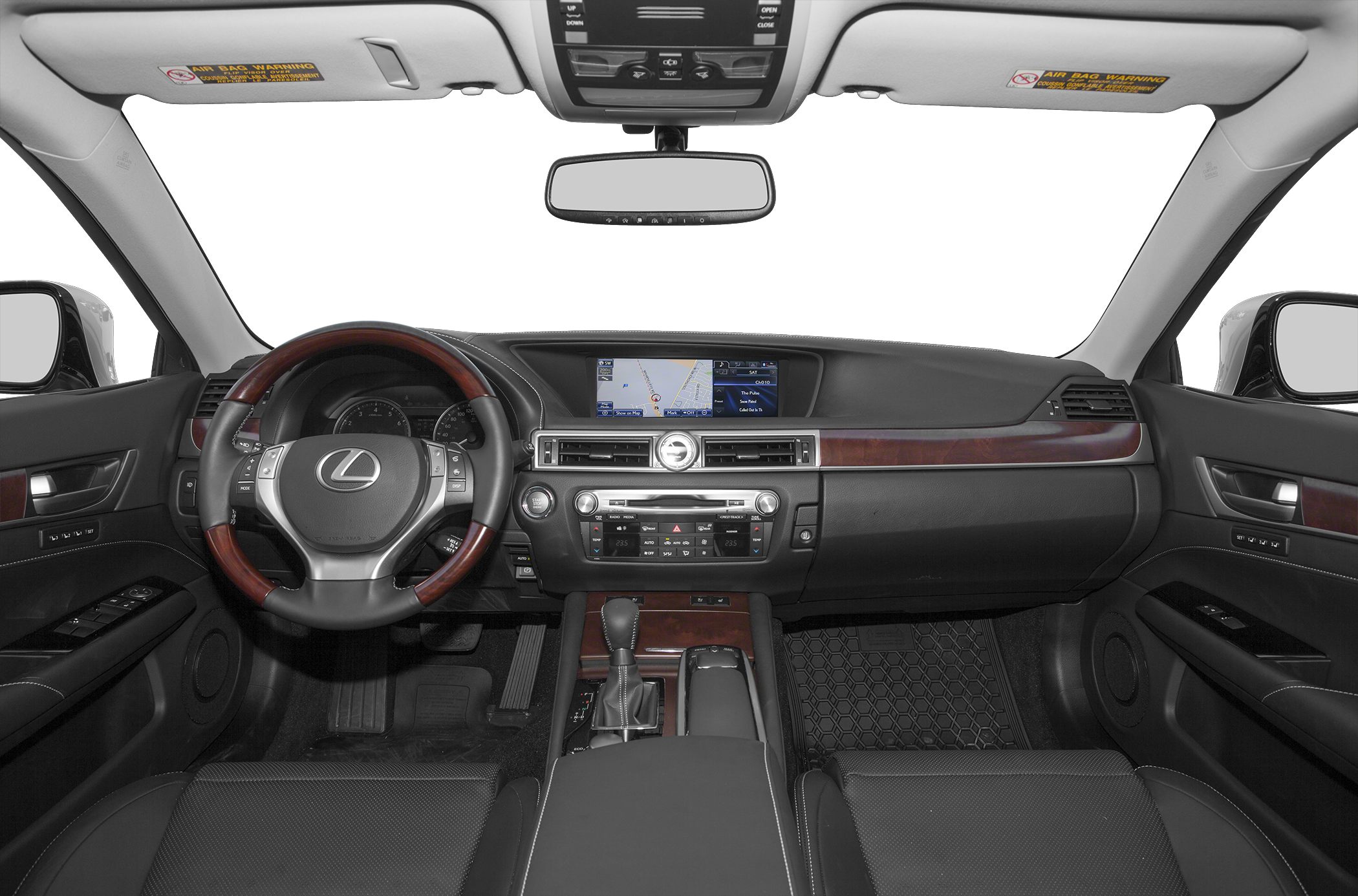 Dashboard and steering wheel with wood trim inside luxury sedan