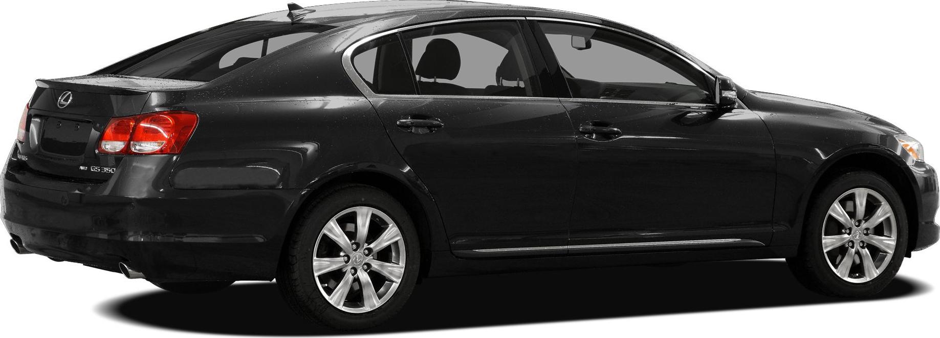 Rear and side profile of a sedan with alloy wheels and shark fin antenna