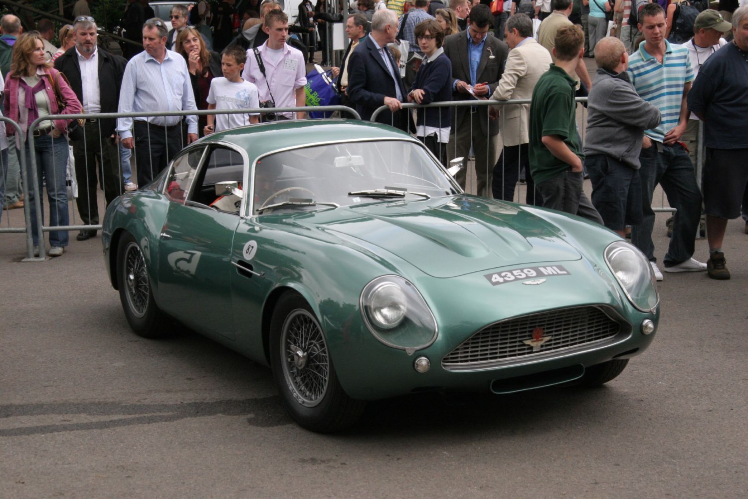 Streamlined vintage sports coupe with smooth curves and wire wheels
