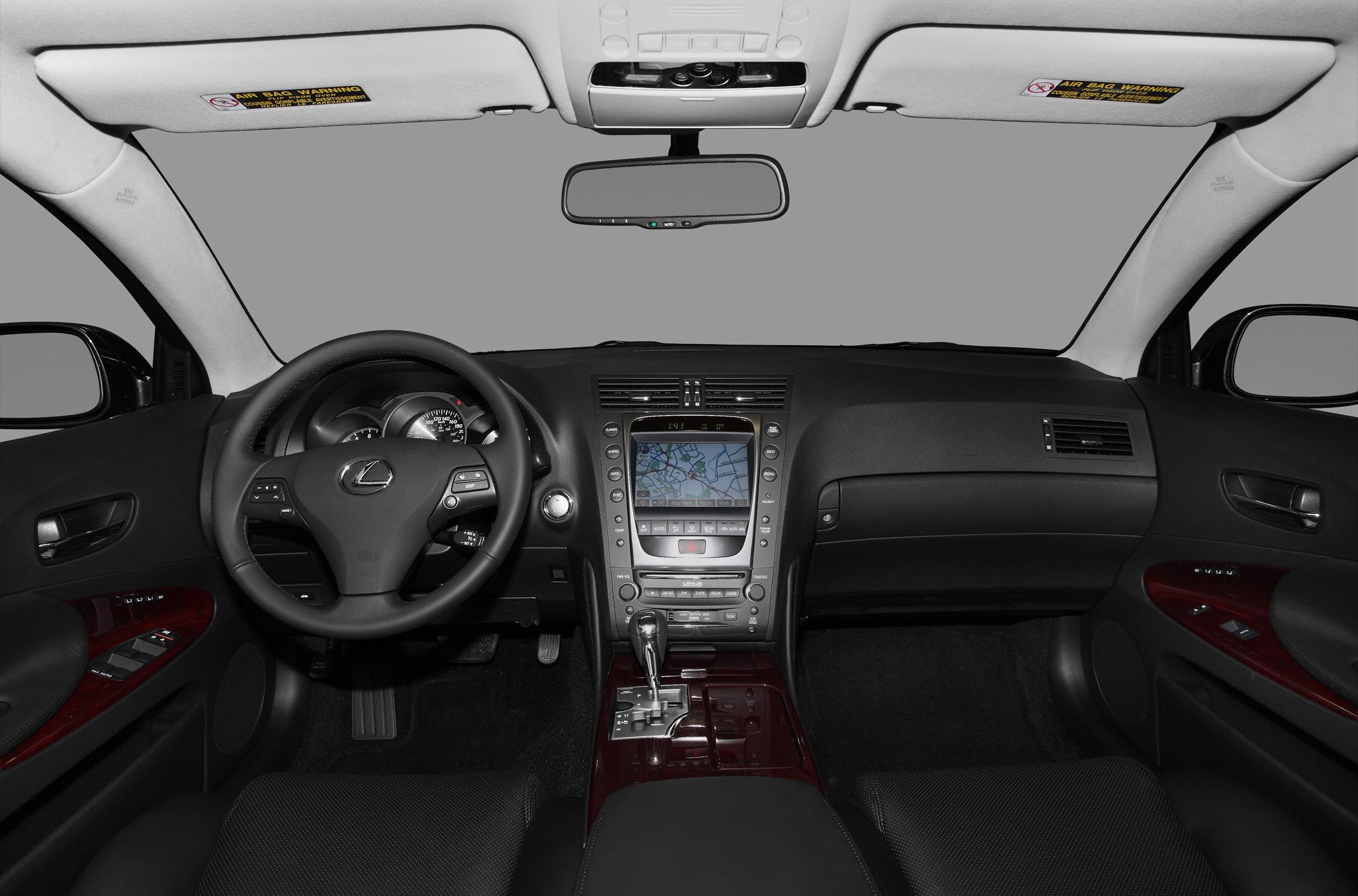 Multifunction steering wheel and built-in navigation screen in luxury sedan interior