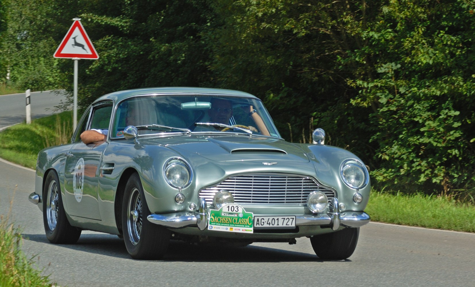 Vintage sports car with chrome grille and fog lights