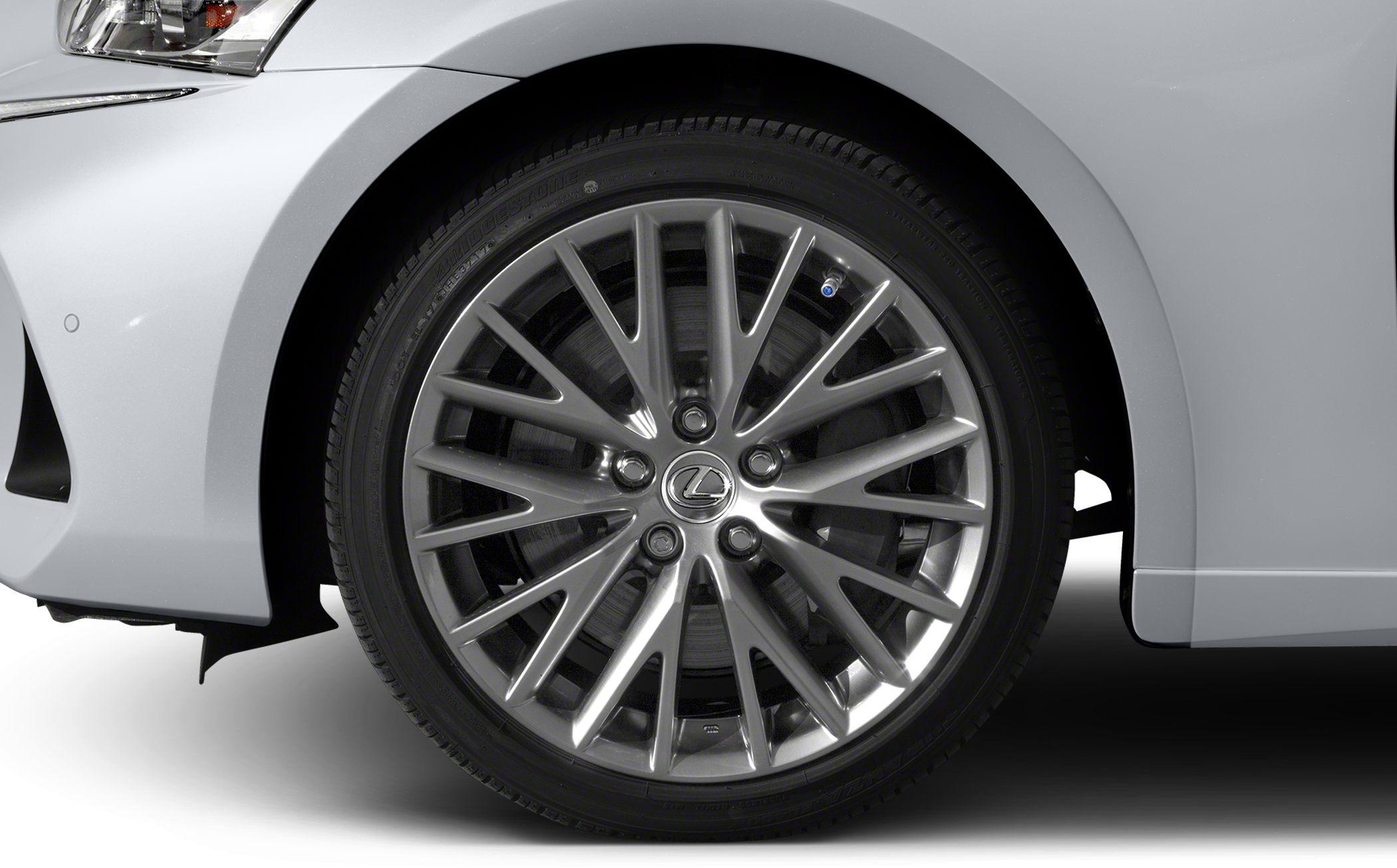 Multi-spoke alloy rim with Bridgestone tire close-up