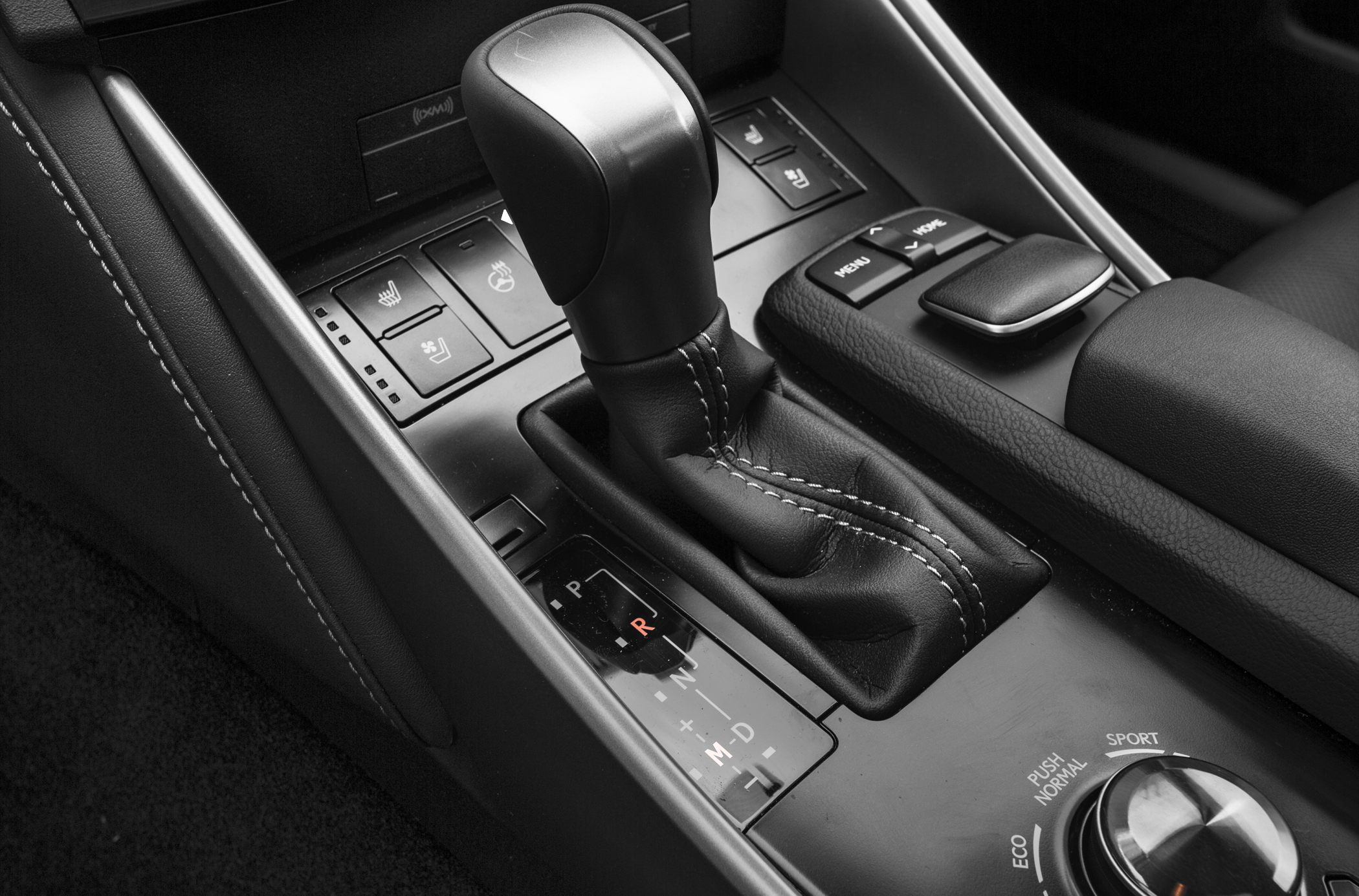 Automatic gear shift lever with drive mode selector and control buttons.