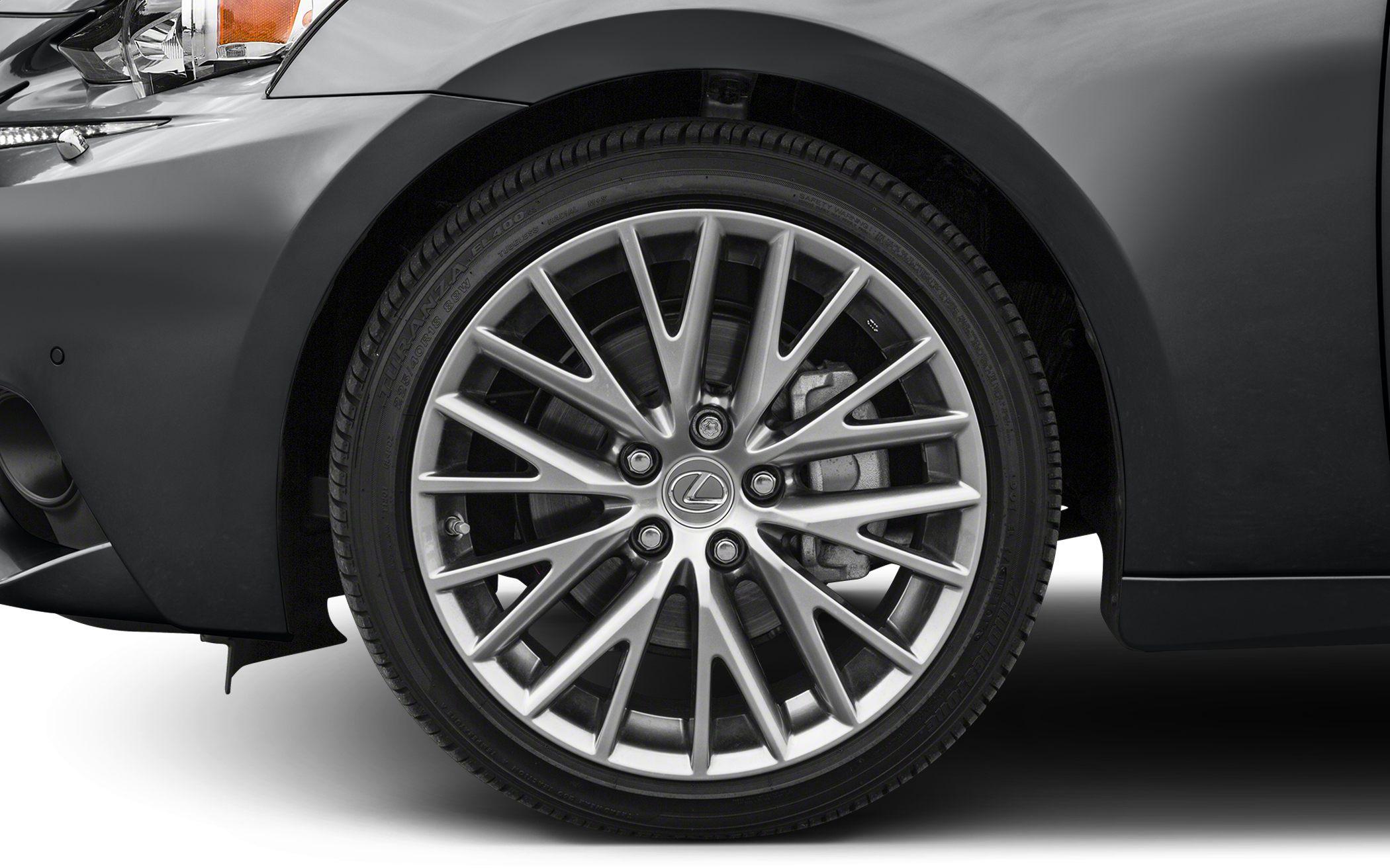 Close-up of alloy wheel with multi-spoke design and front fender section
