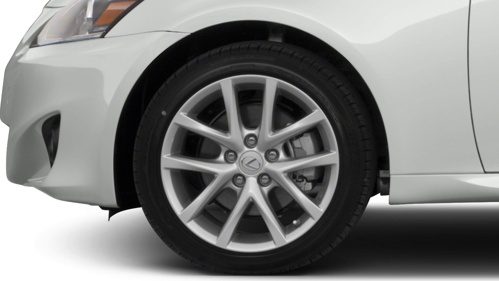Close-up of front alloy wheel and fender with brake caliper visible
