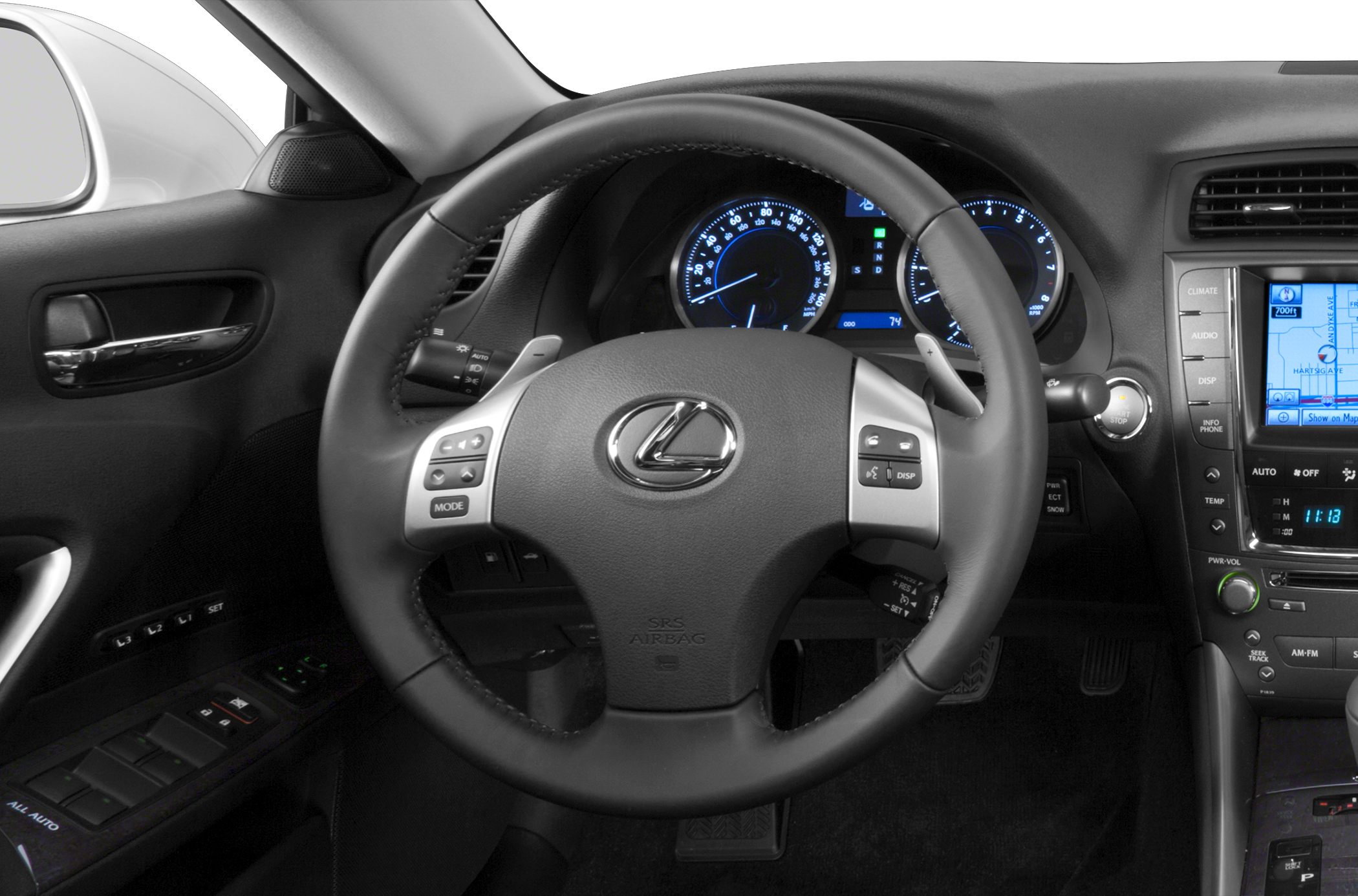 Steering wheel, illuminated dashboard gauges, and navigation screen.