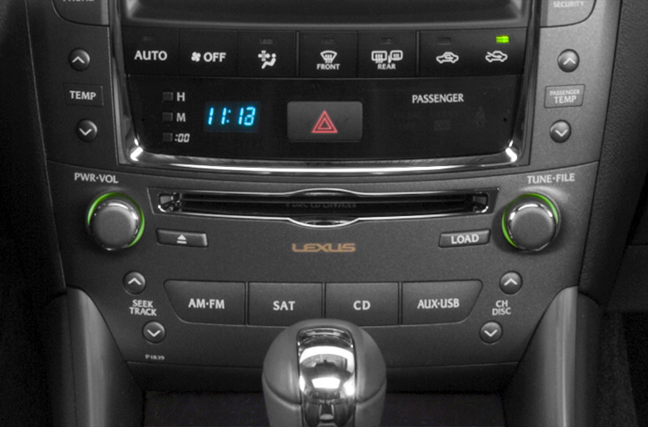 Close-up of audio and climate control panel with gear shift