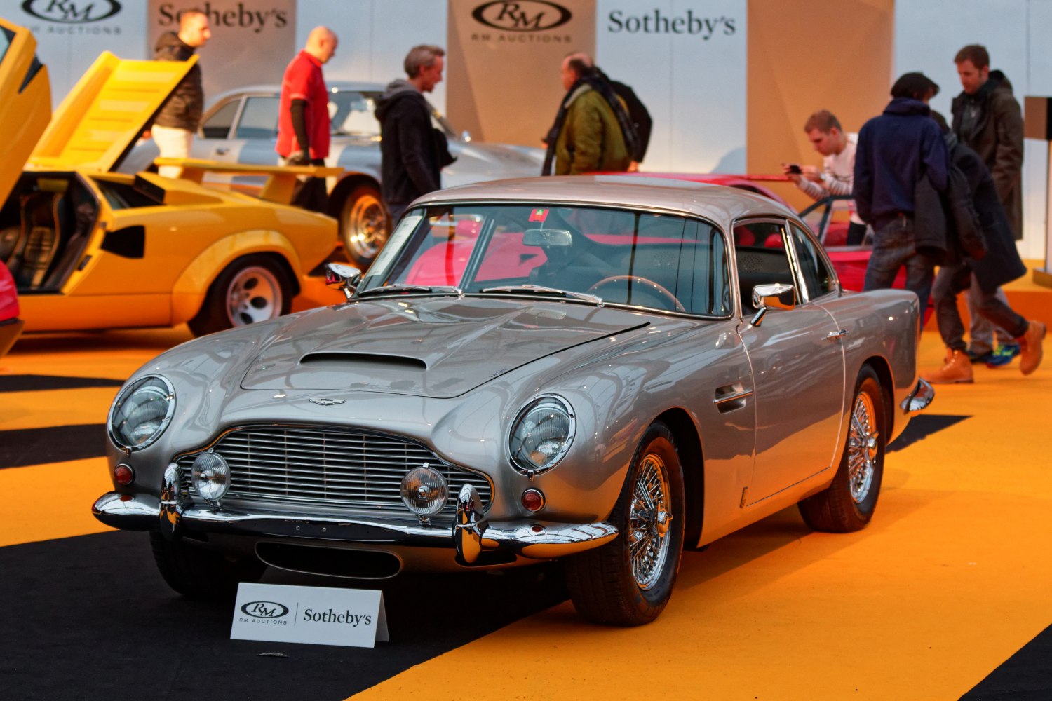 Classic silver vintage coupe with iconic grille and wire wheels