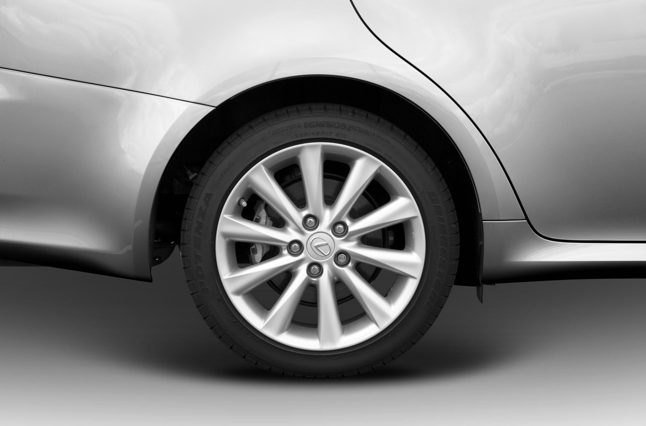 Close-up of a silver alloy wheel and tire.