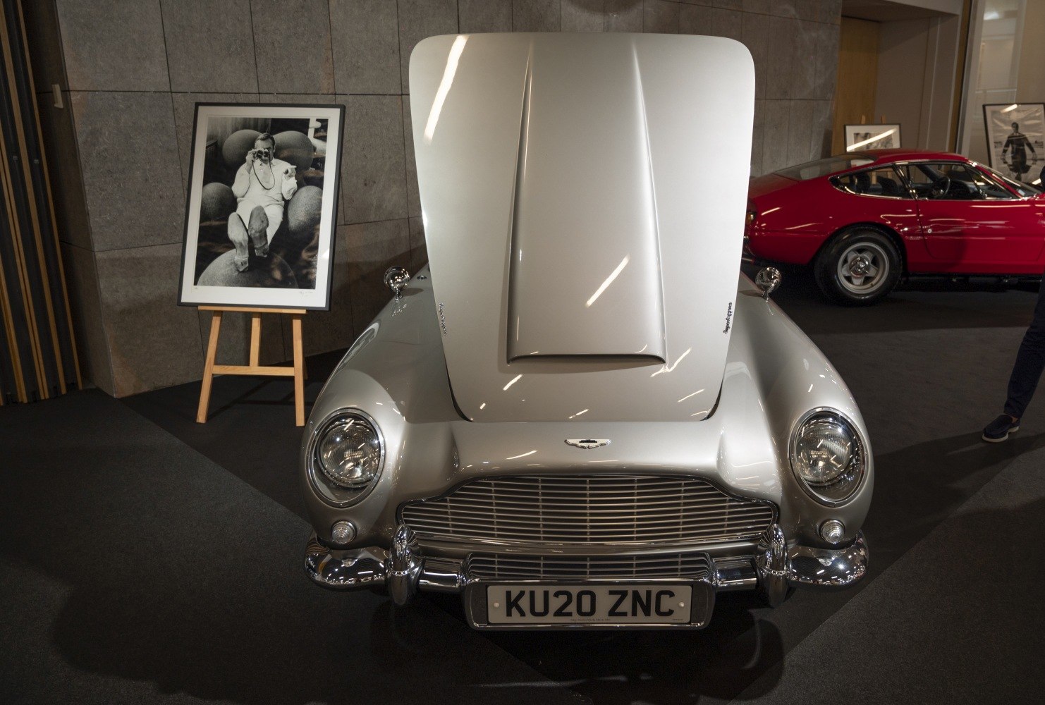 Classic front grille with raised hood of a vintage silver luxury coupe